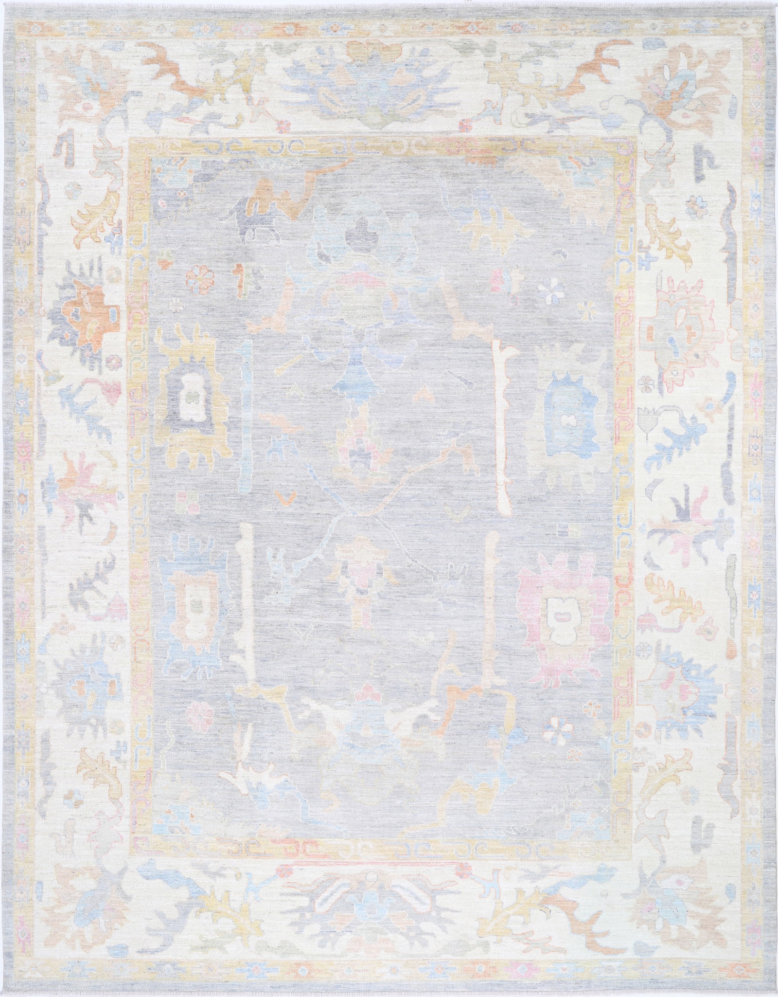 Fine Hand Knotted Oushak Wool Rug - 12'2" x 9'5": This hand-knotted wool rug from Afghanistan?s Oushak collection measures 12?2? by 9?5? in a grand rectangular shape. Showcasing a traditional style, the rug features classic Oushak design elements, kn