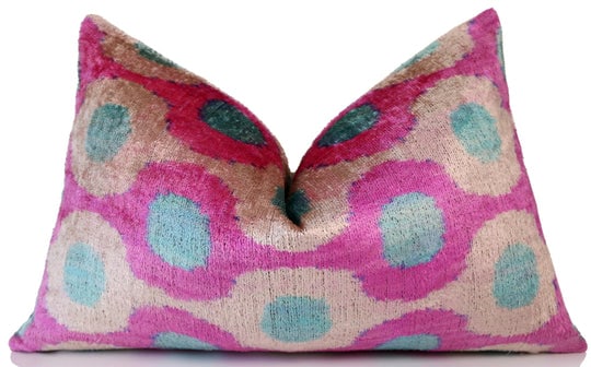 Pink and Aqua Circle Silk Velvet Pillow 16x24 Handmade Luxury Cushion: Product Details:Size: 16x24 inches (40x60 cm)Material: 100% silk velvet, naturally vegetable dyedDesign: Handwoven Ikat pattern with vibrant pink, aqua, and beige tonesBack: 100% natural cotton with h