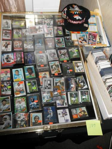Large Football Card Lot: including RC's, Eli Manning Autographed Jersey, Michael Vick multicolored jersey, Brett Faure autographed, Elway, Marino, Multiple Peyton Manning, Urlacher (certified) autographed, Dorett and Largent,
