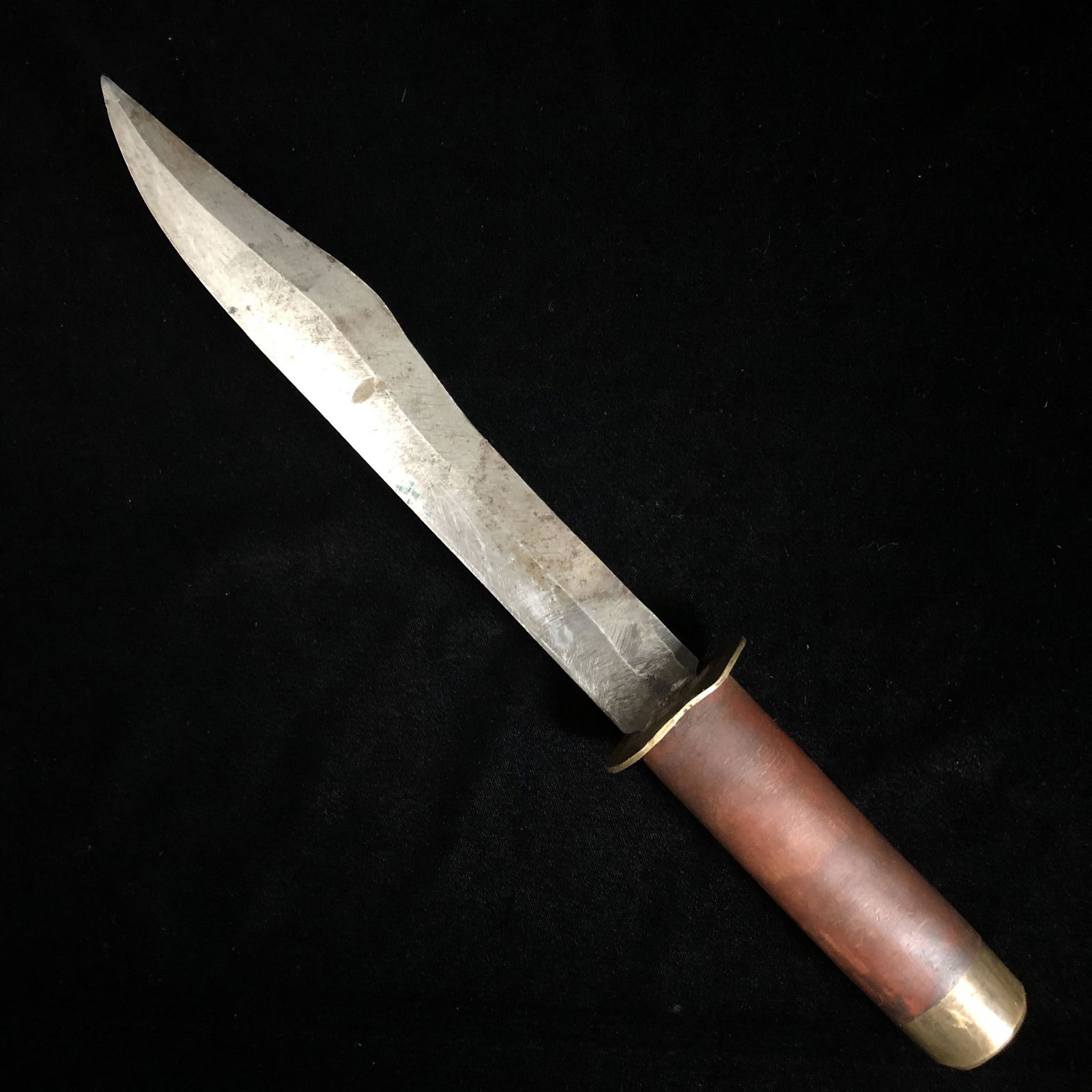 WWII Theater Made Trench Art Knife: WWII theater made fixed blade trench art fighting knife composed of a carbon steel blade with a scrap brass and Bakelite grip. Knife and grip are solid. Appears blade is made from an old file. Sorry,