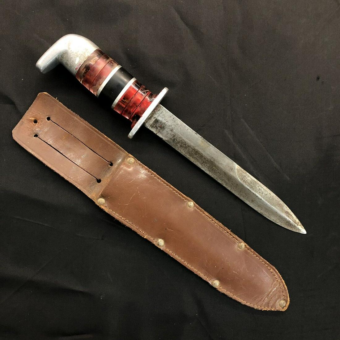 WWII US M3 Paratrooper Knife Theater Made Grip & Sheath: WWII theater modified US M3 paratrooper knife trench art grip. No markings on blade must have been a guard marked M3. Grip composed of scrap plexiglass Bakelite and aluminum. Comes in a named leather