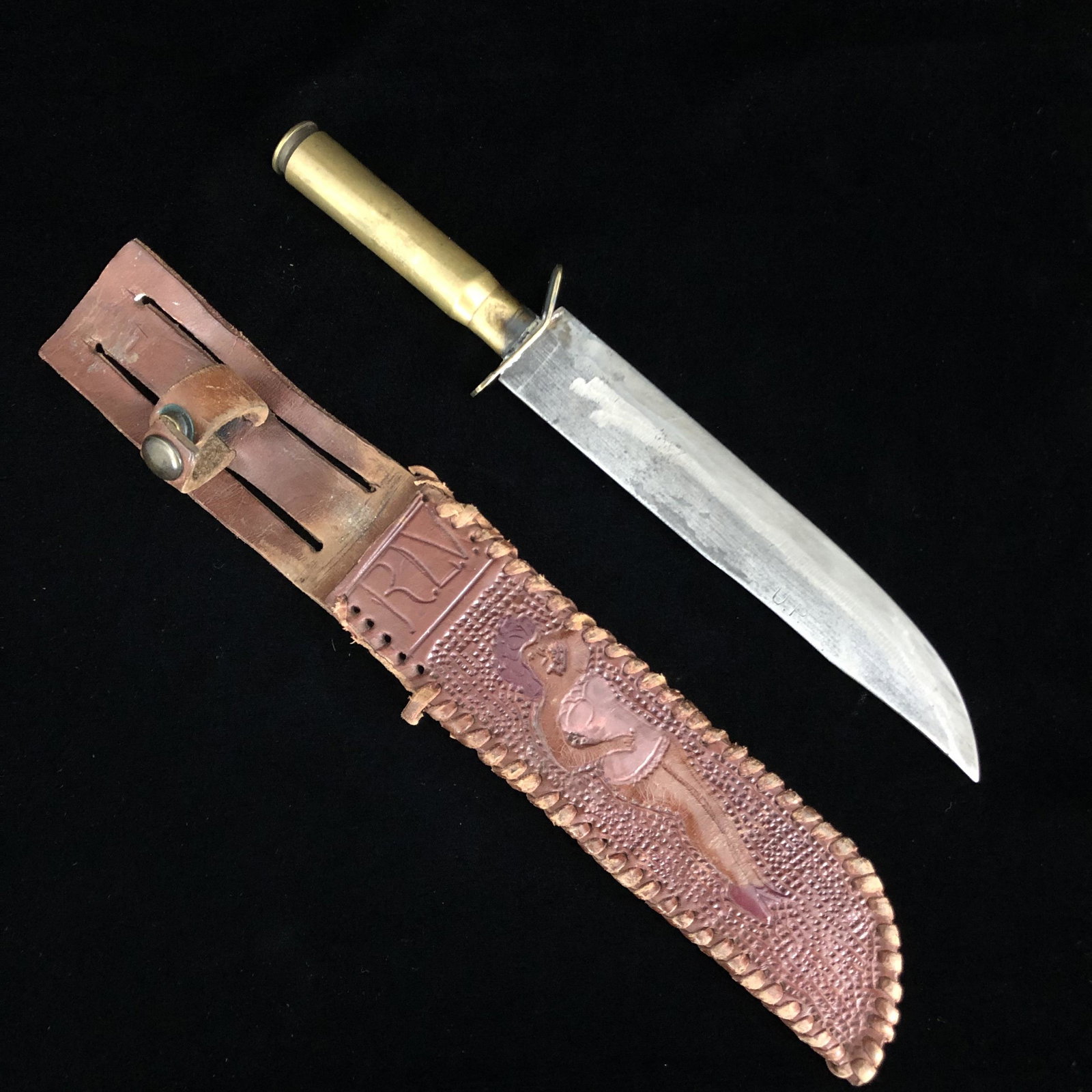 WWII Sweetheart Girl Trench Art Bullet Knife & Sheath: WWII theater made fixed blade trench art bullet casing cartridge 1943 knife in Sexy Lingerie Pin Up Girl hand carved Sweetheart leather sheath initials RLV. Knife appears to have been made from an old