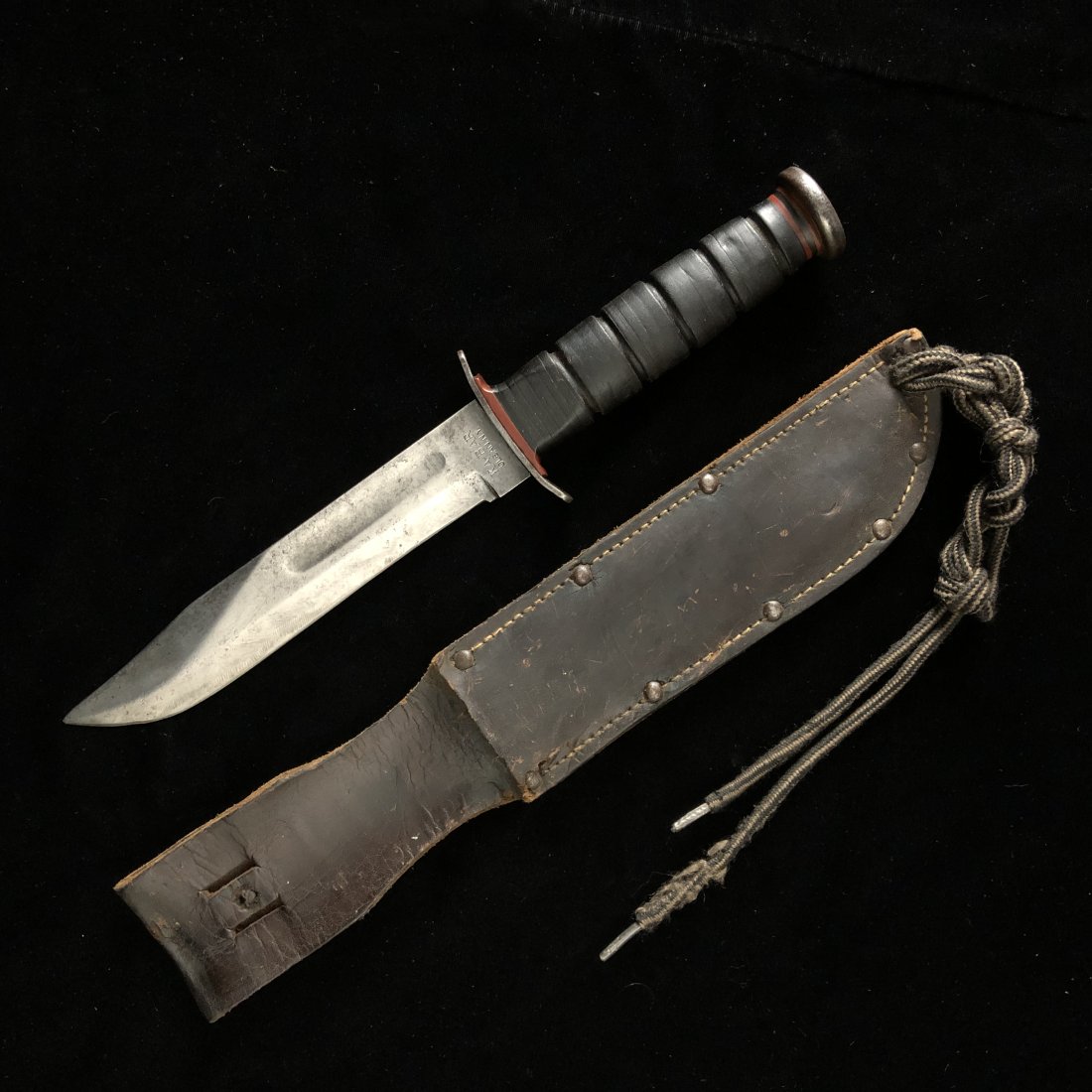 WWII USMC Red Spacer Kabar MK2 Fighting Knife w Sheath: Rare early peened pommel red spacer USMC blade marked Kabar Mk2 fixed blade fighting knife and sheath. Knife has been sharpened, guard has a very slight wiggle. pommel has been ground down. who knows 