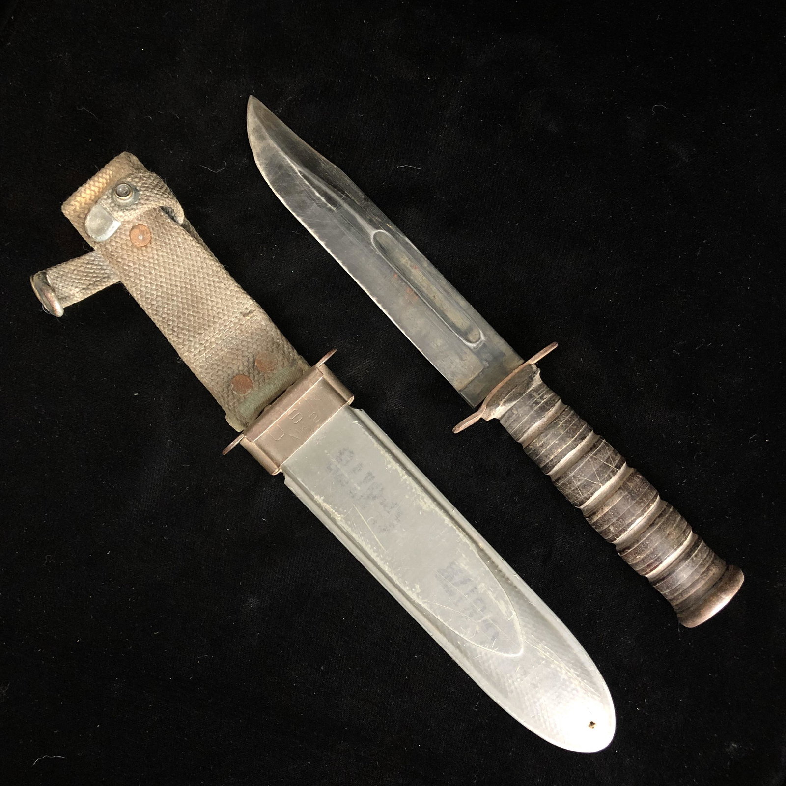 WWII USN Navy Mk2 Fighting Knife & Scabbard: WWII USN guard marked Navy Mk2 fixed blade fighting knife made by camillus cutlery company in its original fiberglass scabbard. Very mild rust. Knife otherwise in good shape. Initials on grip "BWG"