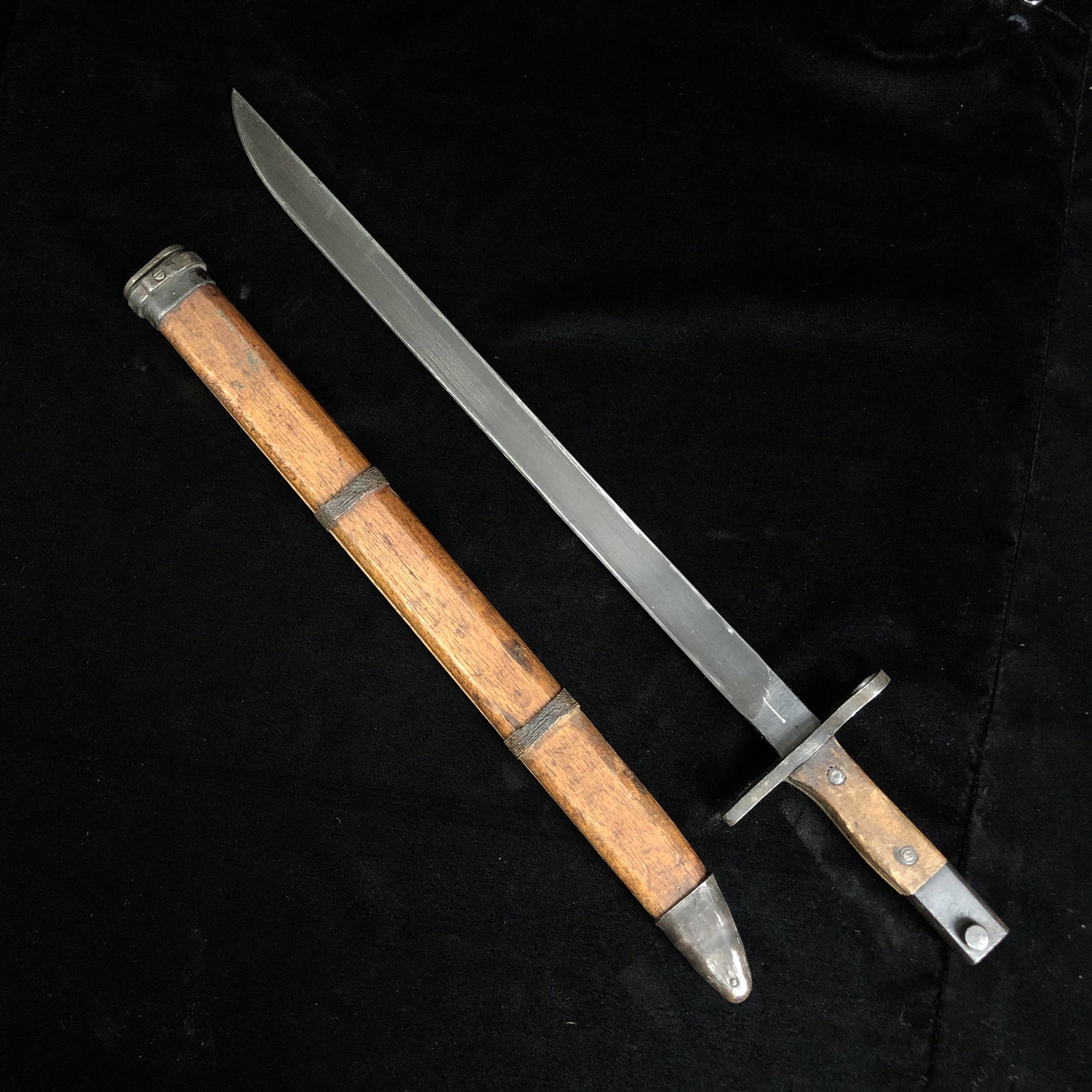 WWII Japanese Late War Bayonet w/ Wood Scabbard: WWII Japanese type 30 arisaka bayonet last ditch square pommel double maker mark straight guard no blood groove in wood / bamboo scabbard. Both in great working condition.