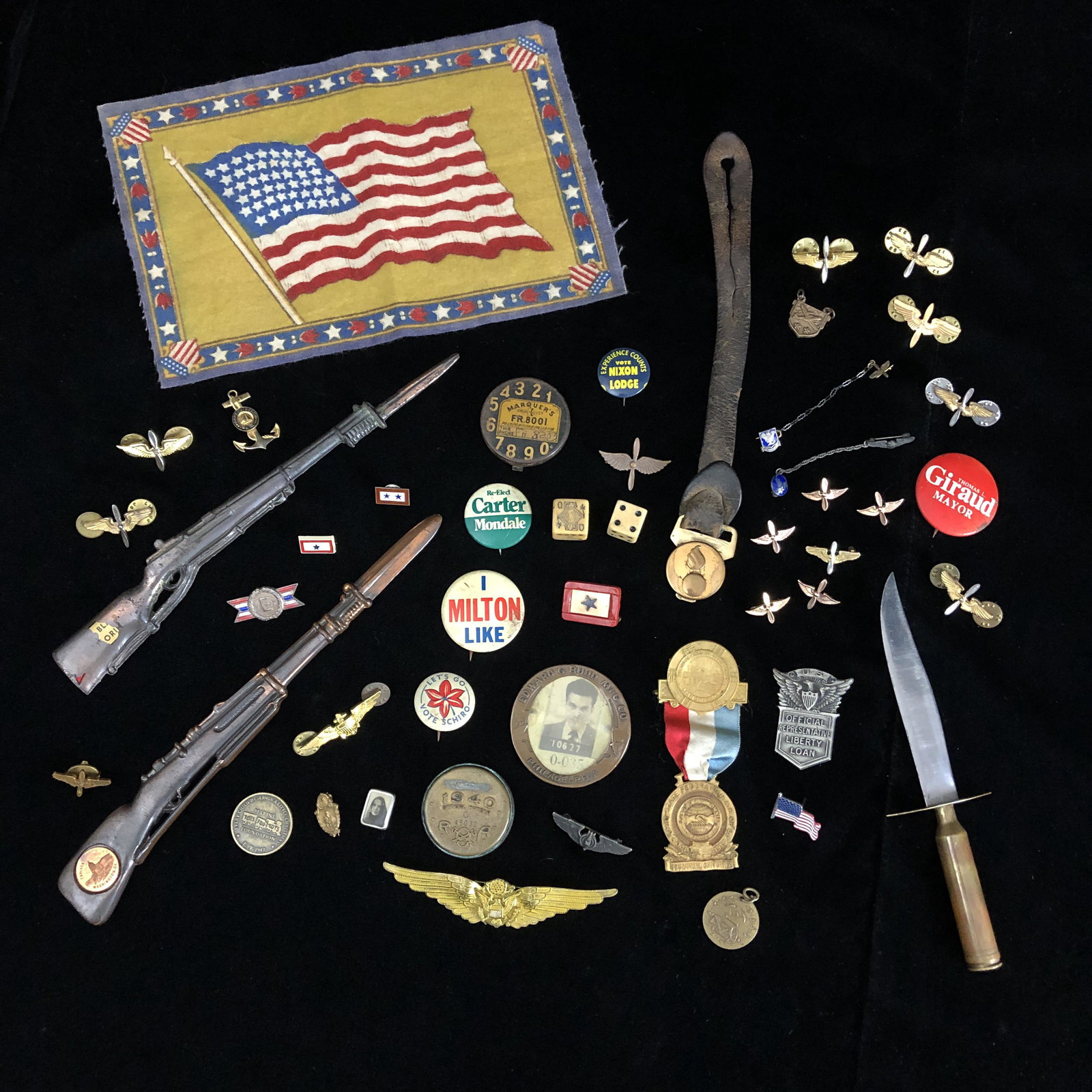 WWII Homefront Lot Incl. Pins, Letter Openers, Worker Badge: WWII Homefront Lot Includes Pins, Two brass M1 Garand Rifle Letter Openers, Wartime Worker ID Badge, Felt Homefront Small Patriotic flag, and other items pictured.