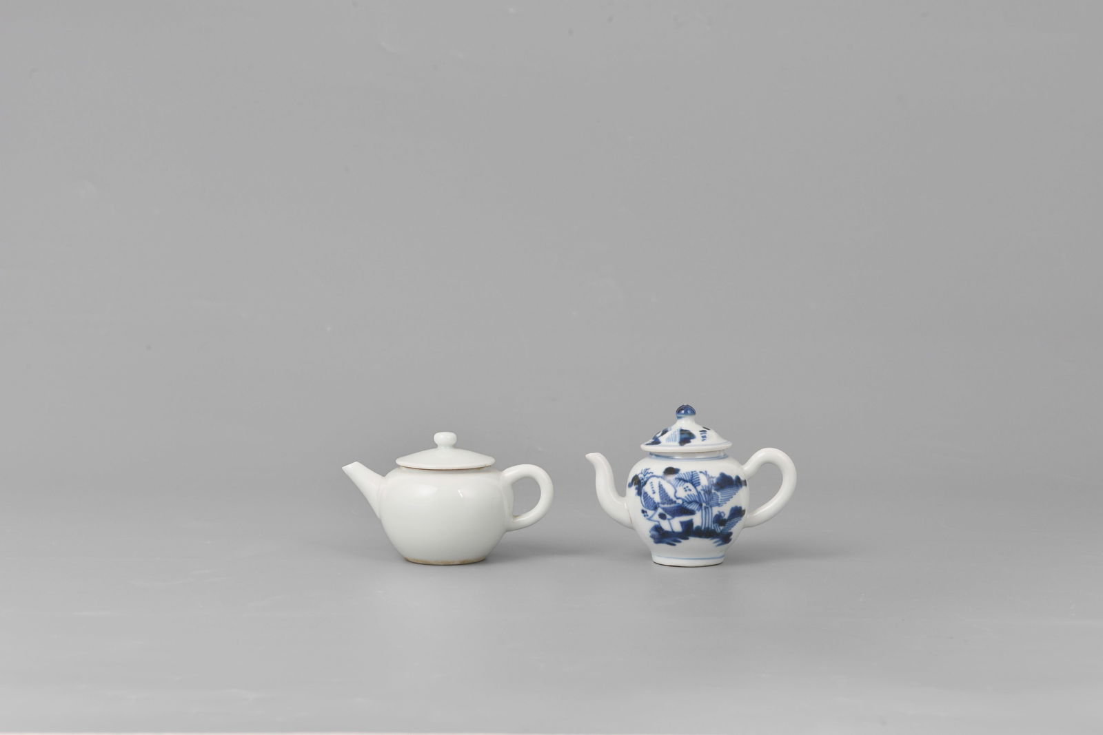 Two teapots with white glaze & underglaze blue (1 of 7)