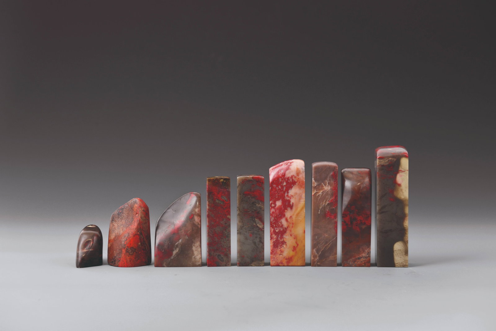 Group of 9 Chicken-blood stone seals: 雞血石印章一組9件