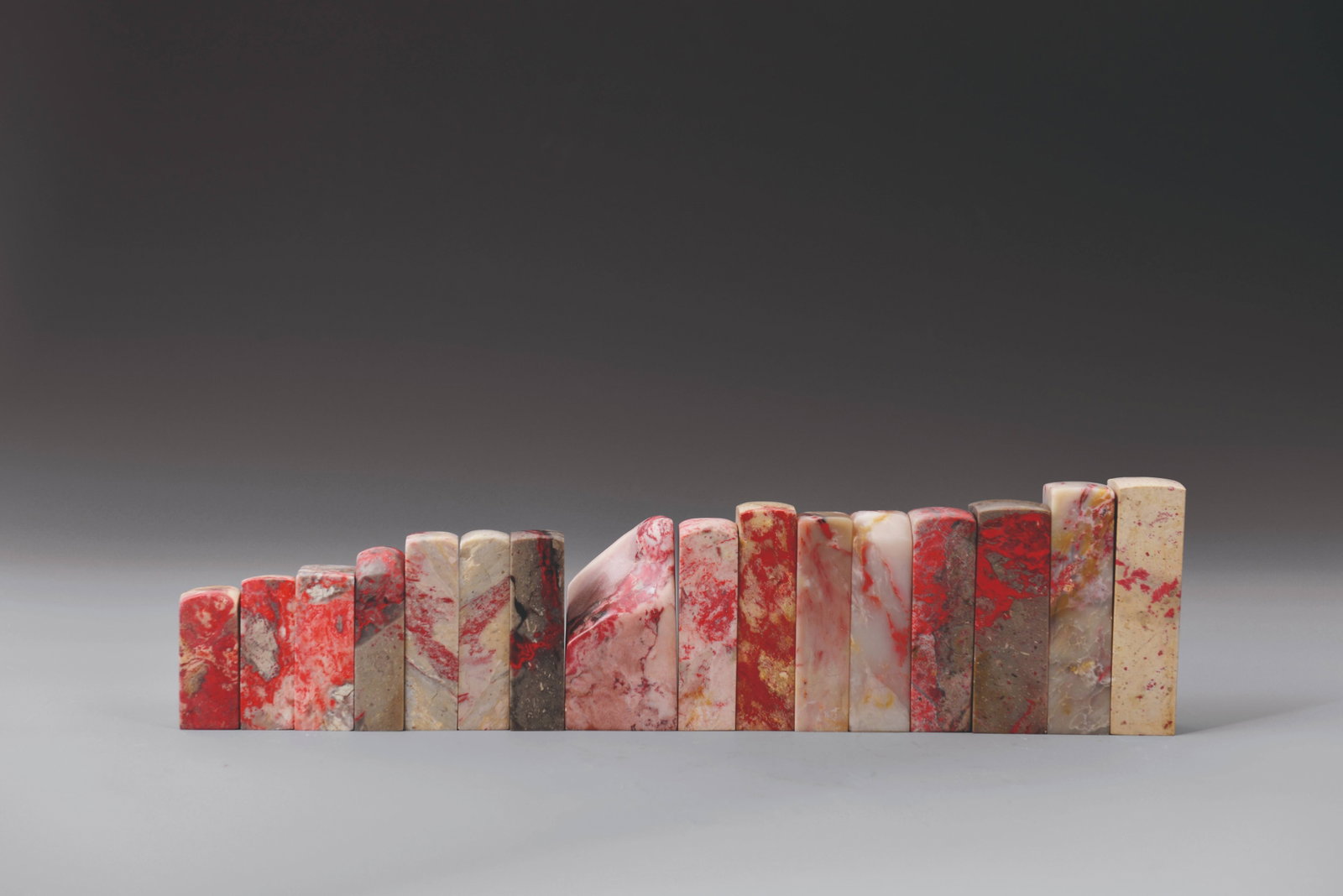 Group of 16 Chicken-blood stone seals: 雞血石印章1組16件