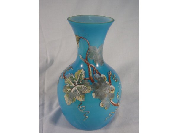 Beautiful Blue Cased glass vase possibly: Holmegaard with a crude rough grape and grape leaf design painted to exterior. Most of the Gold on rim is worn off. No chips, dings, or cracks, heavy wear marks to interior white glass. Measures 10 3/