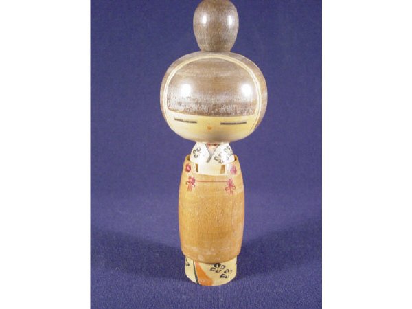 Vintage 40's/50's Wooden Japanese Doll: This delightful wood turned doll is believed to be from the late 1940's or early 50's. It incorporates different woods and stains as well as hand painted accents to render a traditional female Japanes