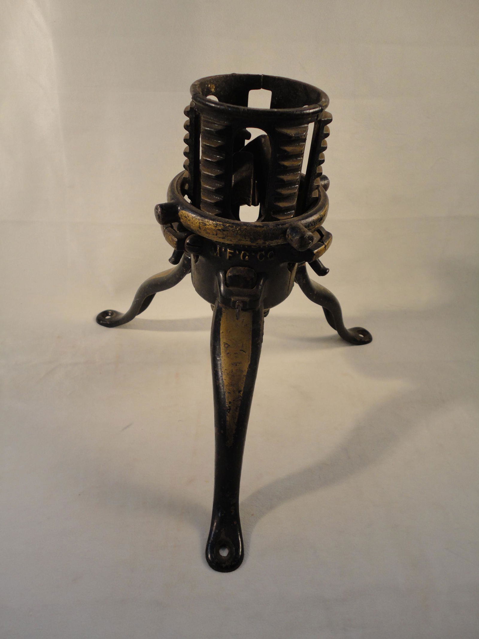 Antique 1920's Cast Iron Christmas Tree Stand - North Bros. Philadelphia PA.: Antique 1920's Cast Iron Christmas Tree Stand - North Bros. Philadelphia PA. This Cast Iron Christmas Tree Stand in in Excellent Condition as pictured. Retains most of gold decorations. It measures 10