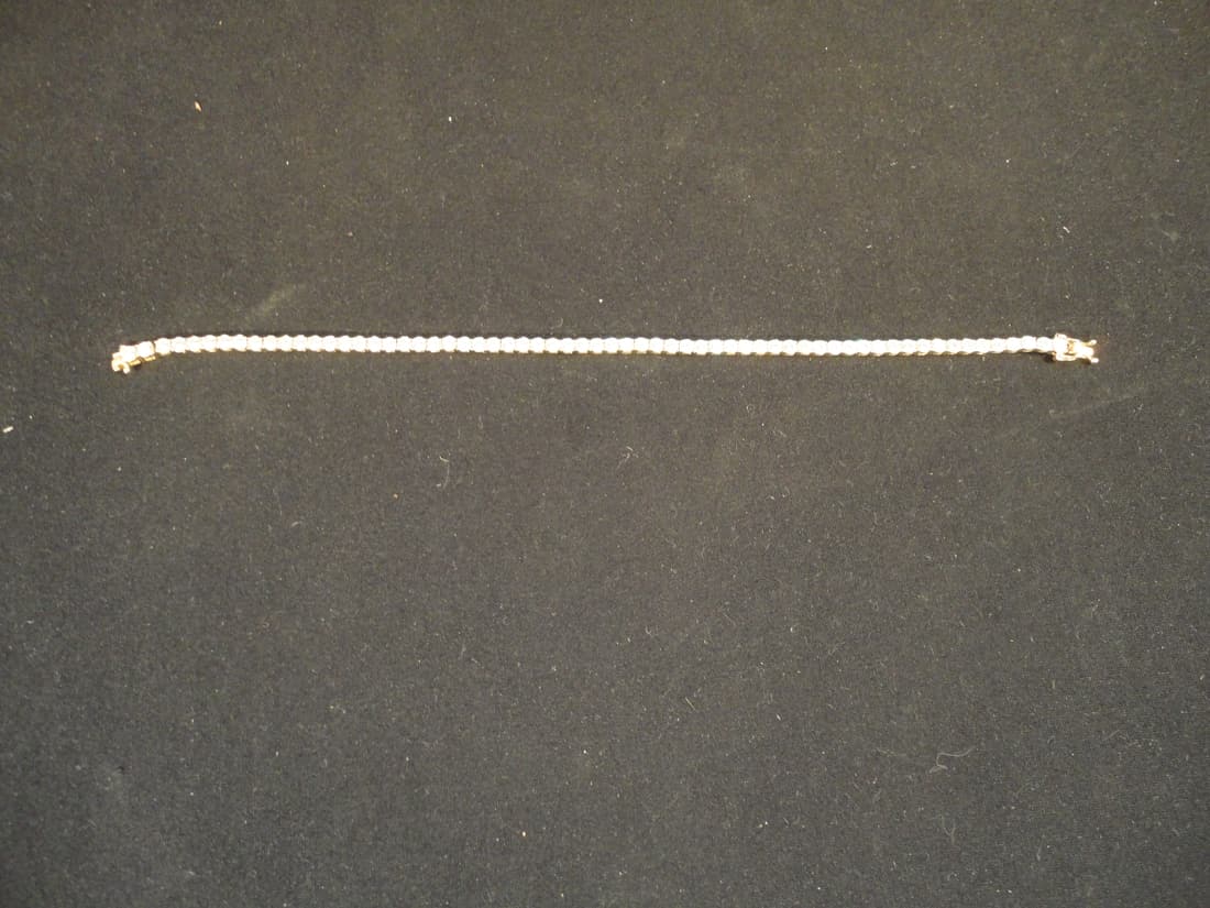 14K Yellow Gold CZ Tennis Bracelet 8.8gr: 14K Yellow Gold CZ Tennis Bracelet 8.8gr. This 14K Tennis Bracelet is in Excellent Condition as pictured. 14K Yellow Gold - Tennis Bracelet - Main Stones: 3mm Cubic Zirconia- Bracelet Length: 8 inches