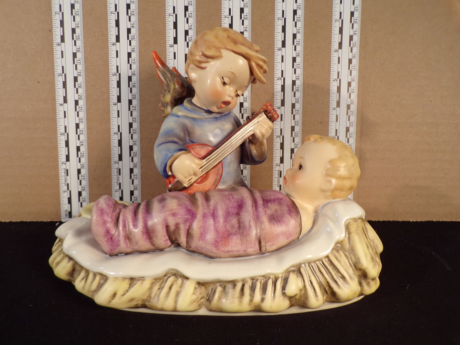 Hummel #24/III, Trademark # - 5, Figurine Name - Lullaby: Up for auction is Hummel #24/III, Trademark # - 5, Figurine Name - Lullaby, This hummel does not have a box and displays these special attributes: Candleholder. This Hummel is in excellent condition w