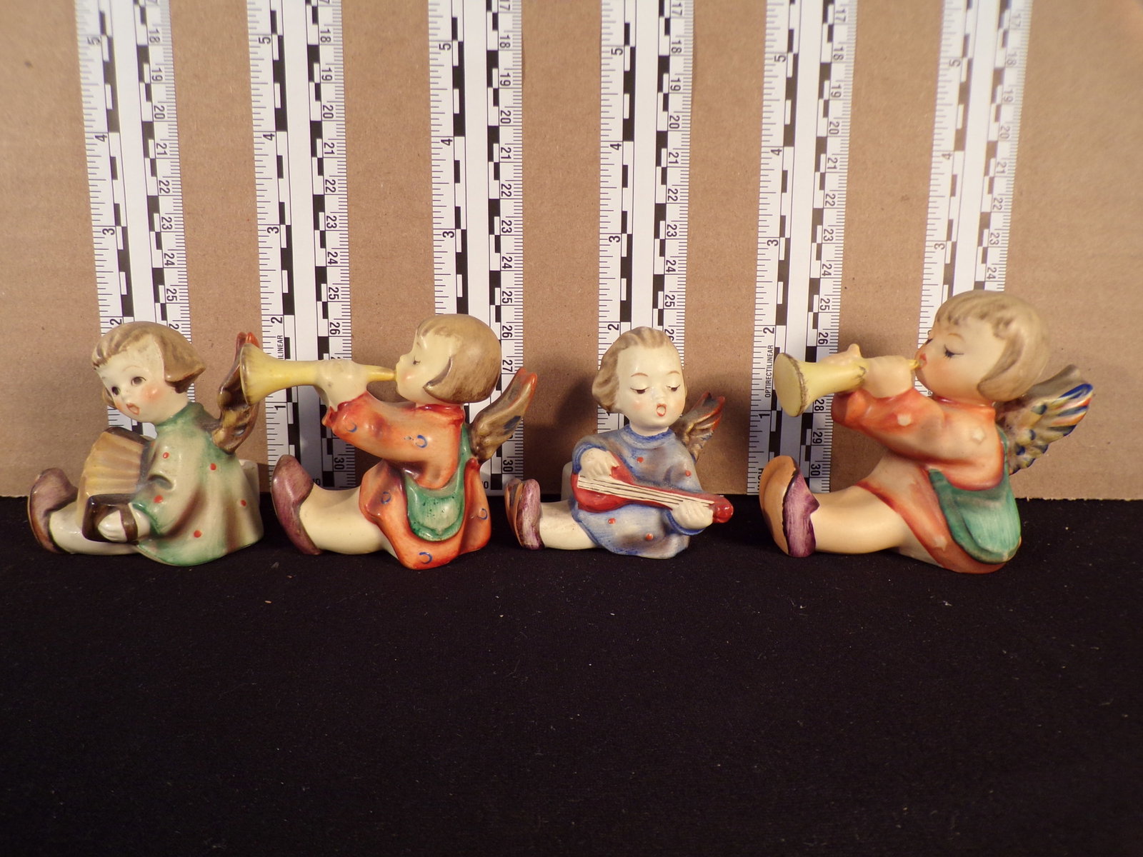 Hummels #38, #39, #40 & #40. Various Trademarks, Figurine Name - Joyous News Angel Candleholders.: Up for auction are Hummels #38, #39, #40 & #40. Various Trademarks, Figurine Name - Joyous News Angel Candleholders. These hummels do not have a box and displays these special attributes: None. These 