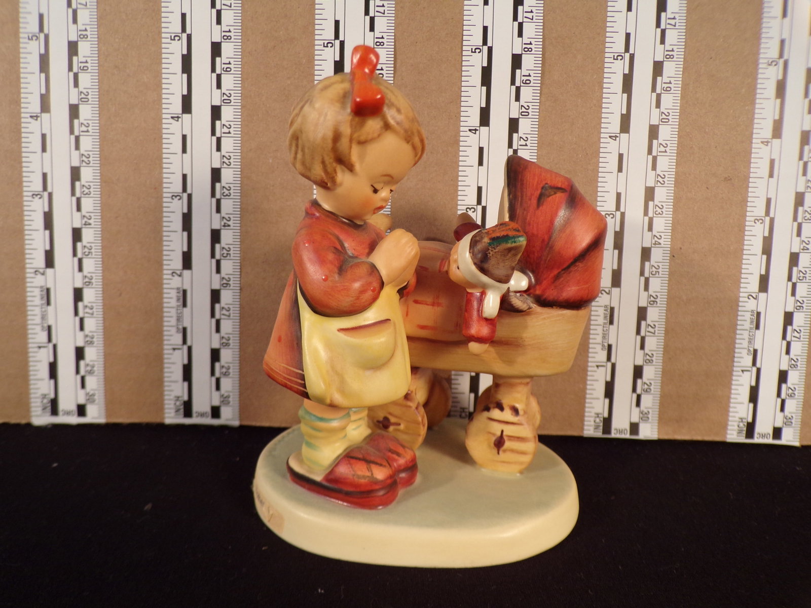 Hummel #67, Trademark # - 6, Figurine Name - Doll Mother: Up for auction is Hummel #67, Trademark # - 6, Figurine Name - Doll Mother, This hummel does not have a box and displays these special attributes: None. This Hummel is in excellent condition with no c