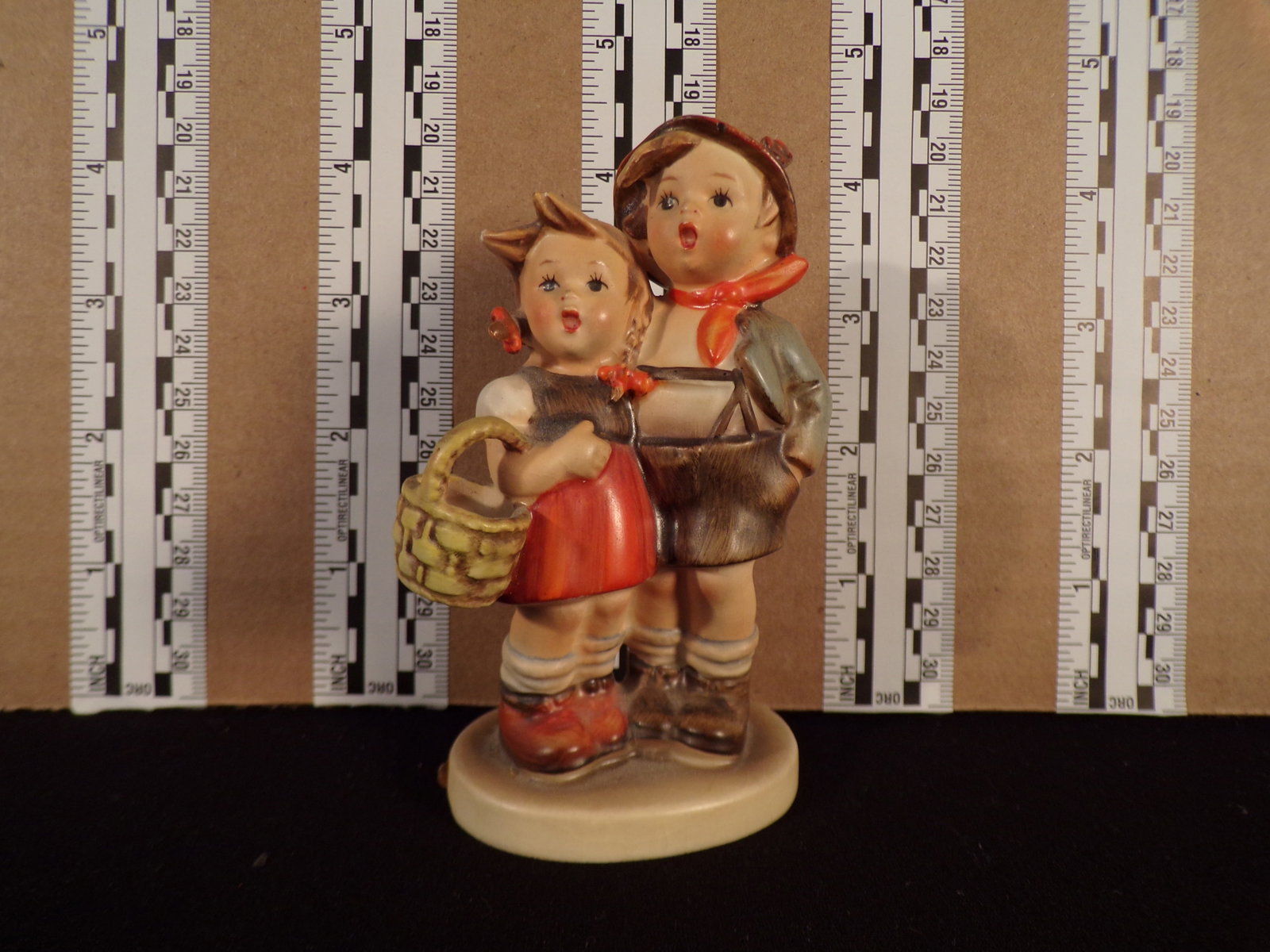 Hummel #94, Trademark # - 3, Figurine Name - Surprise: Up for auction is Hummel #94, Trademark # - 3, Figurine Name - Surprise, This hummel does not have a box and displays these special attributes: None. This Hummel is in excellent condition with no chip
