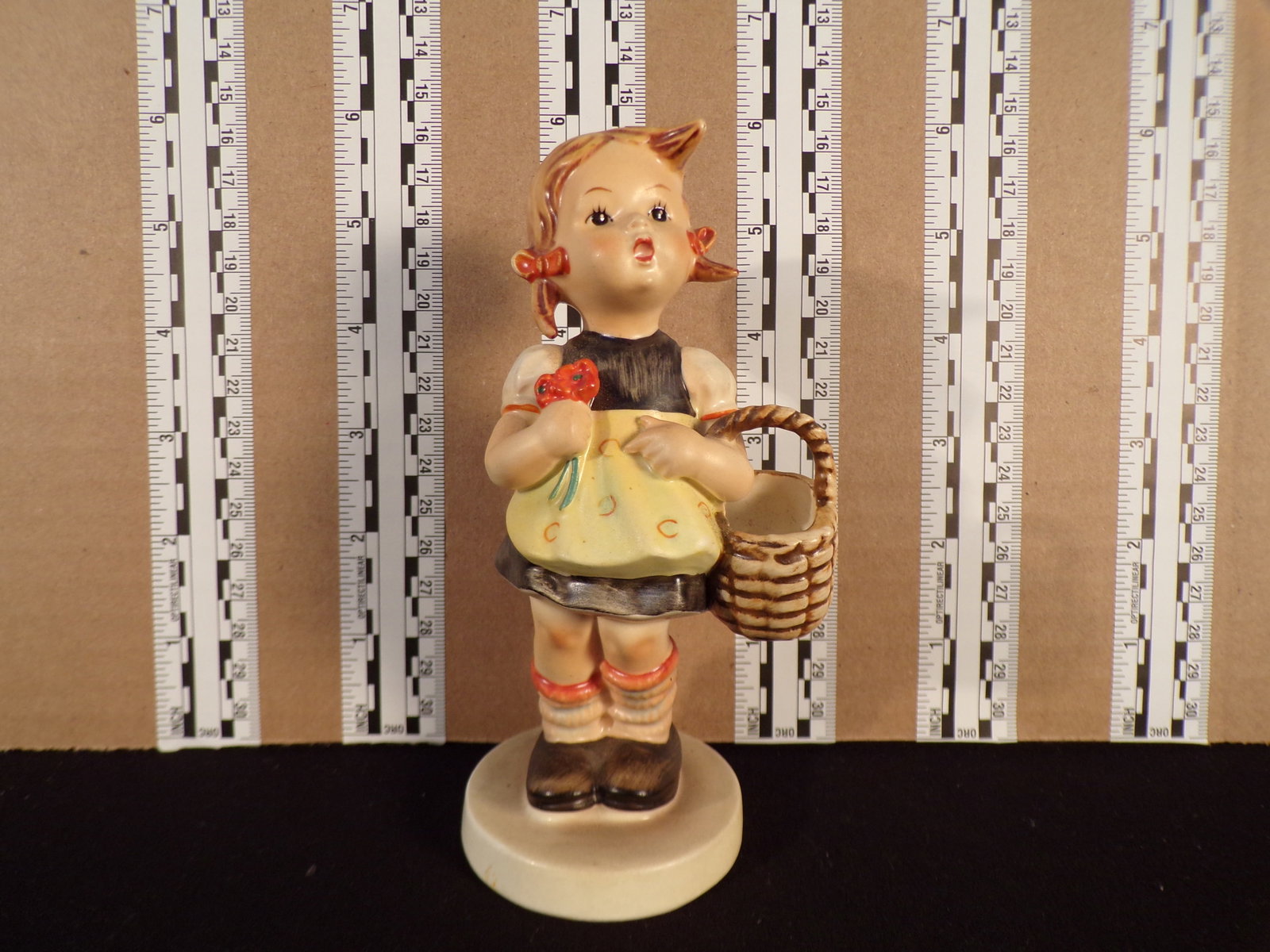 Hummel #98, Trademark # - 3, Figurine Name - Sister: Up for auction is Hummel #98, Trademark # - 3, Figurine Name - Sister, This hummel does not have a box and displays these special attributes: None. This Hummel is in excellent condition with no chips 