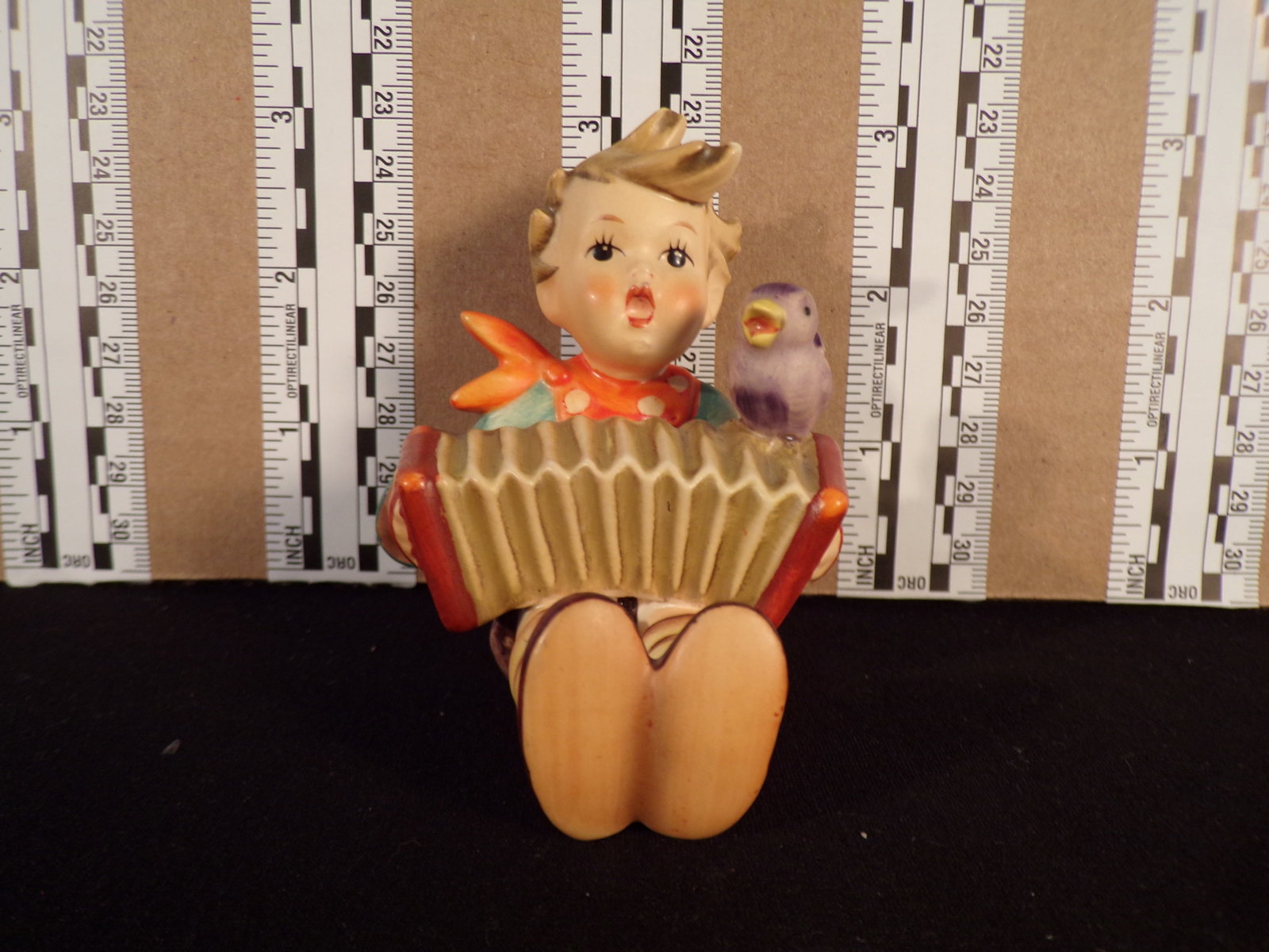 Hummel #110, Trademark # - 4, Figurine Name - Let'S Sing: Up for auction is Hummel #110, Trademark # - 4, Figurine Name - Let'S Sing, This hummel does not have a box and displays these special attributes: None. This Hummel is in excellent condition with no c