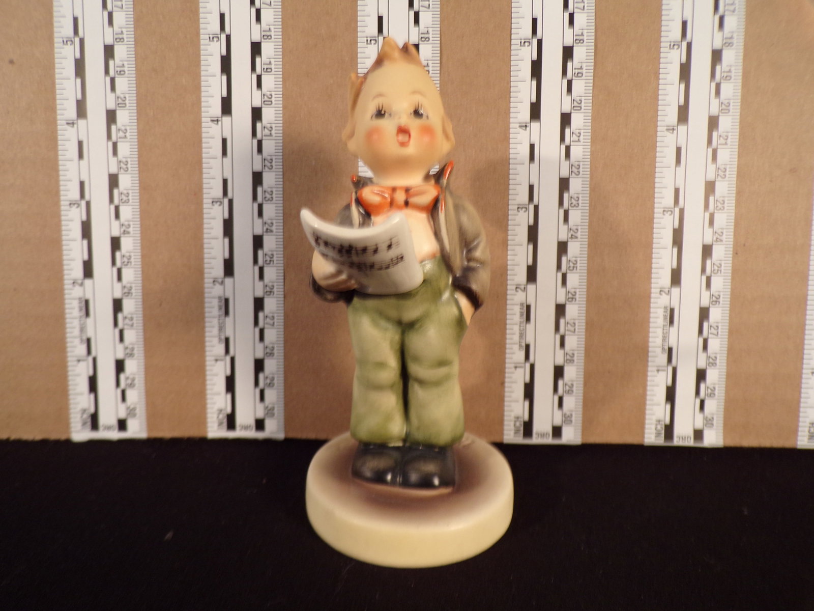 Hummel #135, Trademark # - 5, Figurine Name - Soloist: Up for auction is Hummel #135, Trademark # - 5, Figurine Name - Soloist, This hummel does not have a box and displays these special attributes: None. This Hummel is in excellent condition with no chip