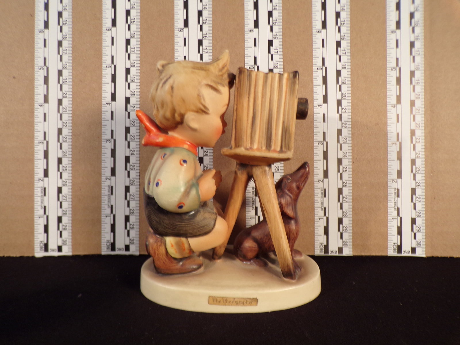 Hummel #178, Trademark # - 3, Figurine Name - The Photographer: Up for auction is Hummel #178, Trademark # - 3, Figurine Name - The Photographer, This hummel does not have a box and displays these special attributes: None. This Hummel is in excellent condition wit