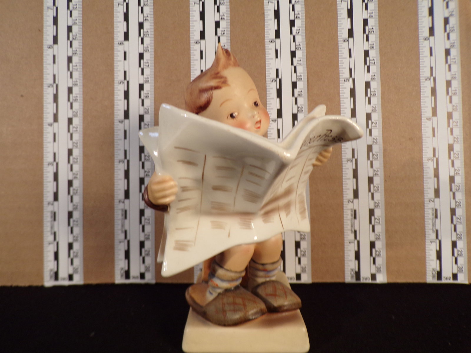 Hummel #184, Trademark # - 2, Figurine Name - Latest News: Up for auction is Hummel #184, Trademark # - 2, Figurine Name - Latest News, This hummel does not have a box and displays these special attributes: None. This Hummel is in excellent condition with no 