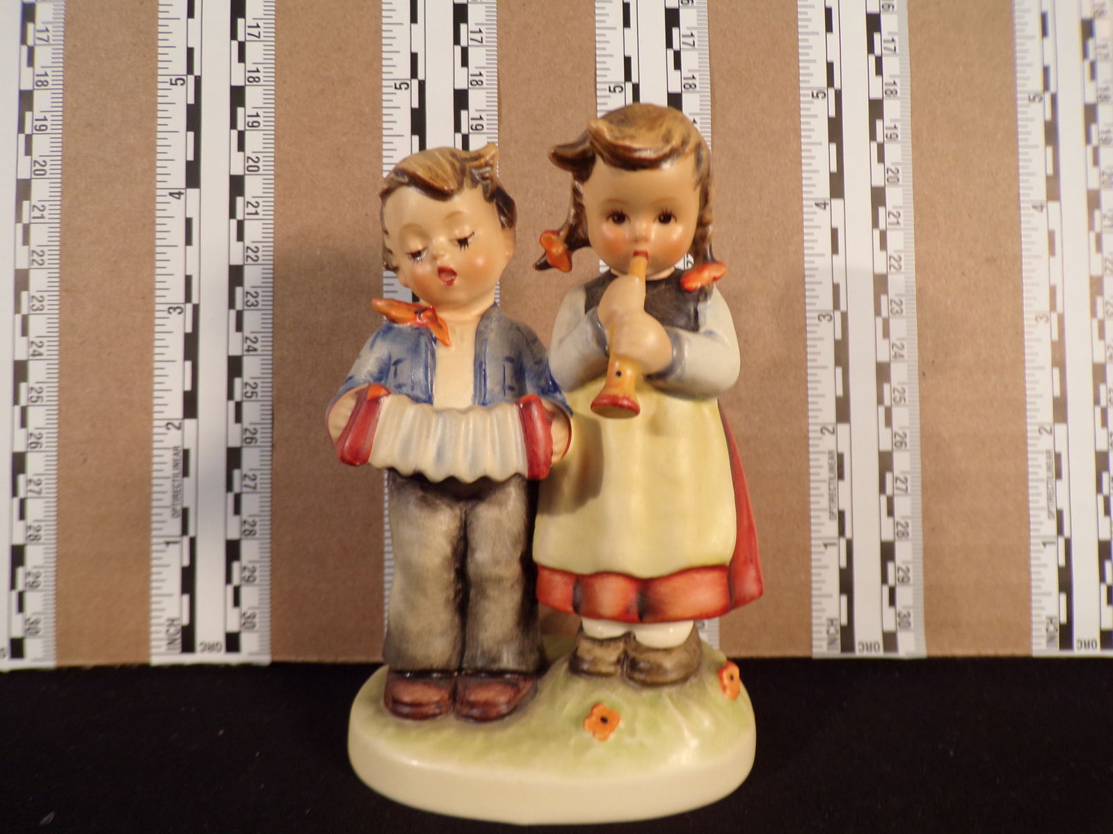 Hummel #218, Size Indicator # - 218 2/0 Trademark # - 4, Figurine Name - Birthday Serenade: Up for auction is Hummel #218, Size Indicator - 218 2/0, Trademark # - 4, Figurine Name - Birthday Serenade, This hummel does not have a box and displays these special attributes: None. This Hummel is