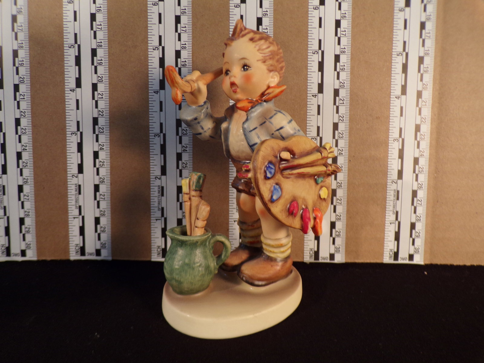 Hummel #304, Trademark # - 5, Figurine Name - The Artist: Up for auction is Hummel #304, Trademark # - 5, Figurine Name - The Artist, This hummel does not have a box and displays these special attributes: None. This Hummel is in excellent condition with no c