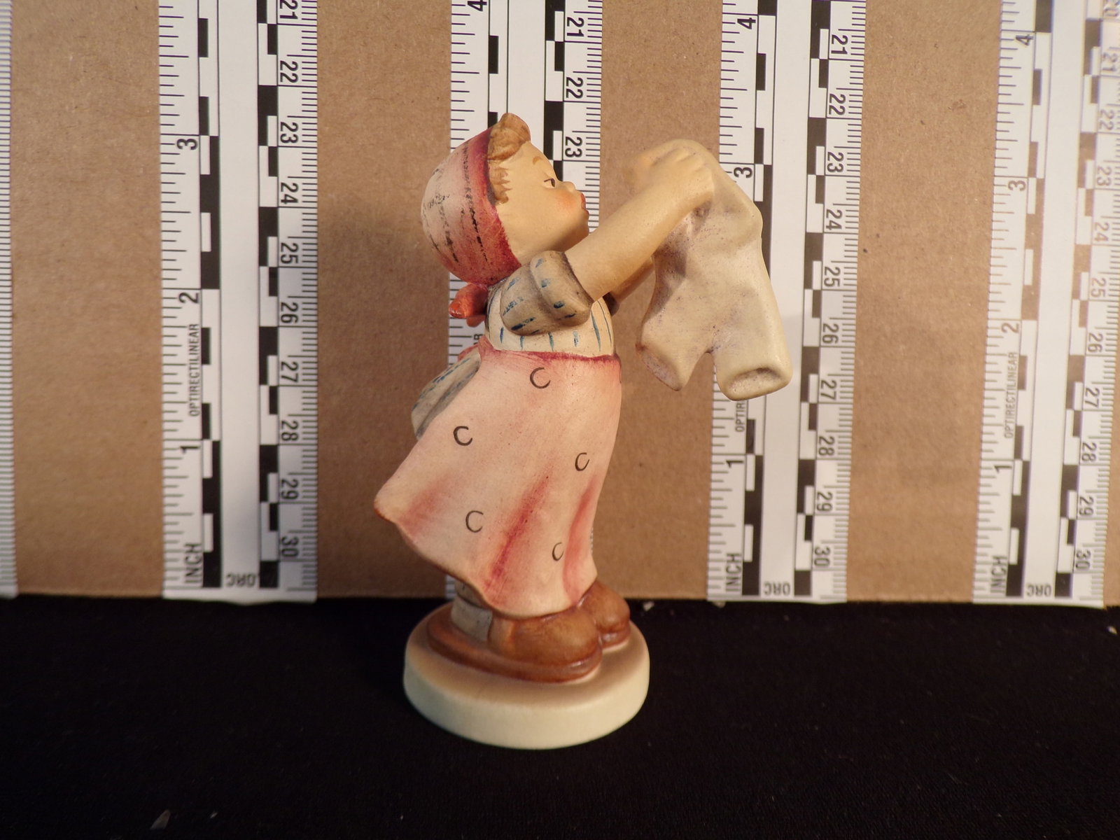 Hummel #321, Size Indicator # - 321 4/0 Trademark # - 6, Figurine Name - Wash Day: Up for auction is Hummel #321, Size Indicator - 321 4/0, Trademark # - 6, Figurine Name - Wash Day, This hummel does not have a box and displays these special attributes: None. This Hummel is in excel