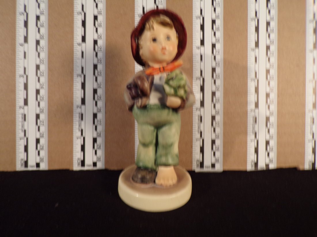 Hummel #374, Trademark # - 5, Figurine Name - Lost Stocking: Up for auction is Hummel #374,Trademark # - 5, Figurine Name - Lost Stocking, This Hummel does not have a box and displays these special attributes: Very Tiny Flake on base edge. This Hummel is in exc
