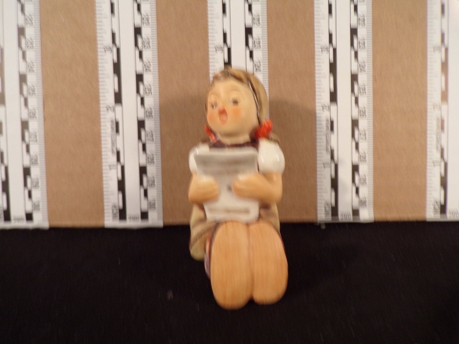 Hummel #389, Trademark # - 6, Figurine Name - Girl With Sheet Music: Up for auction is Hummel #389, Trademark # - 6, Figurine Name - Girl With Sheet Music, This hummel does not have a box and displays these special attributes: None. This Hummel is in excellent conditio