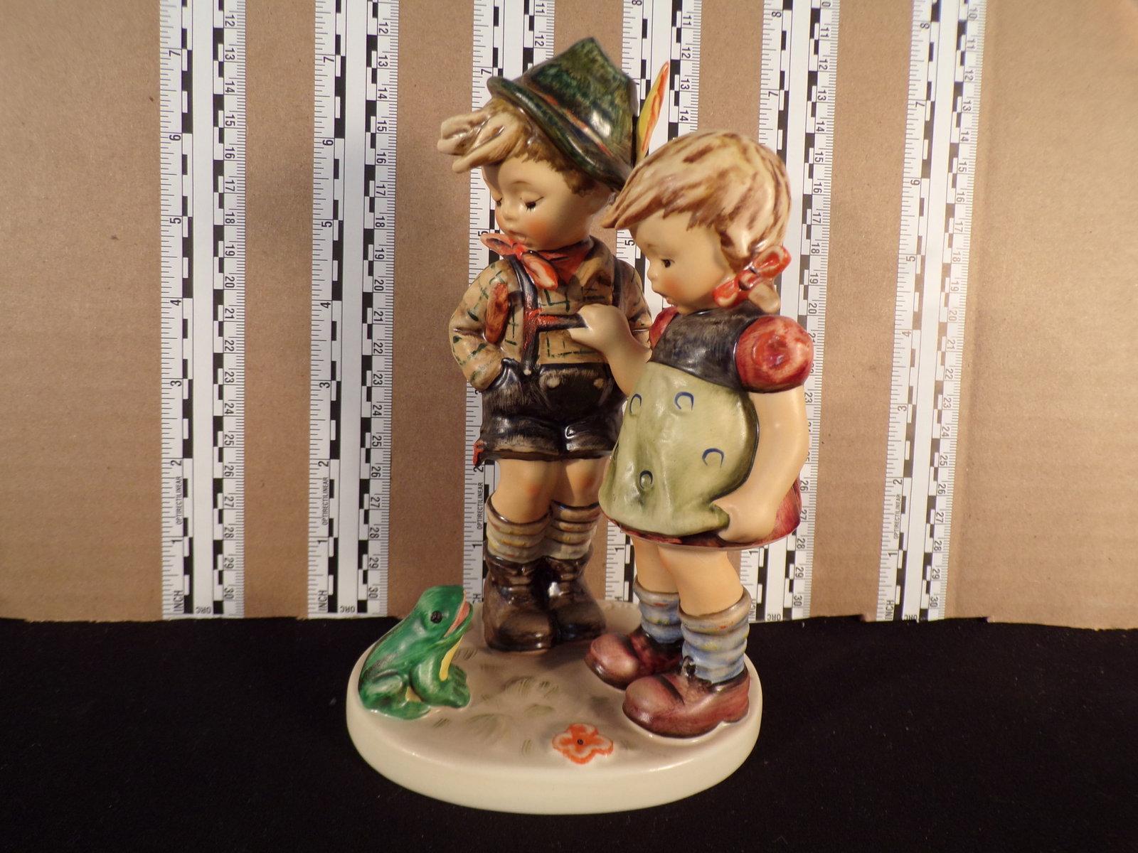 Hummel #394, Trademark # - 6, Figurine Name - Timid Little Sister: Up for auction is Hummel #394, Trademark # - 6, Figurine Name - Timid Little Sister, This hummel does not have a box and displays these special attributes: None. This Hummel is in excellent condition 