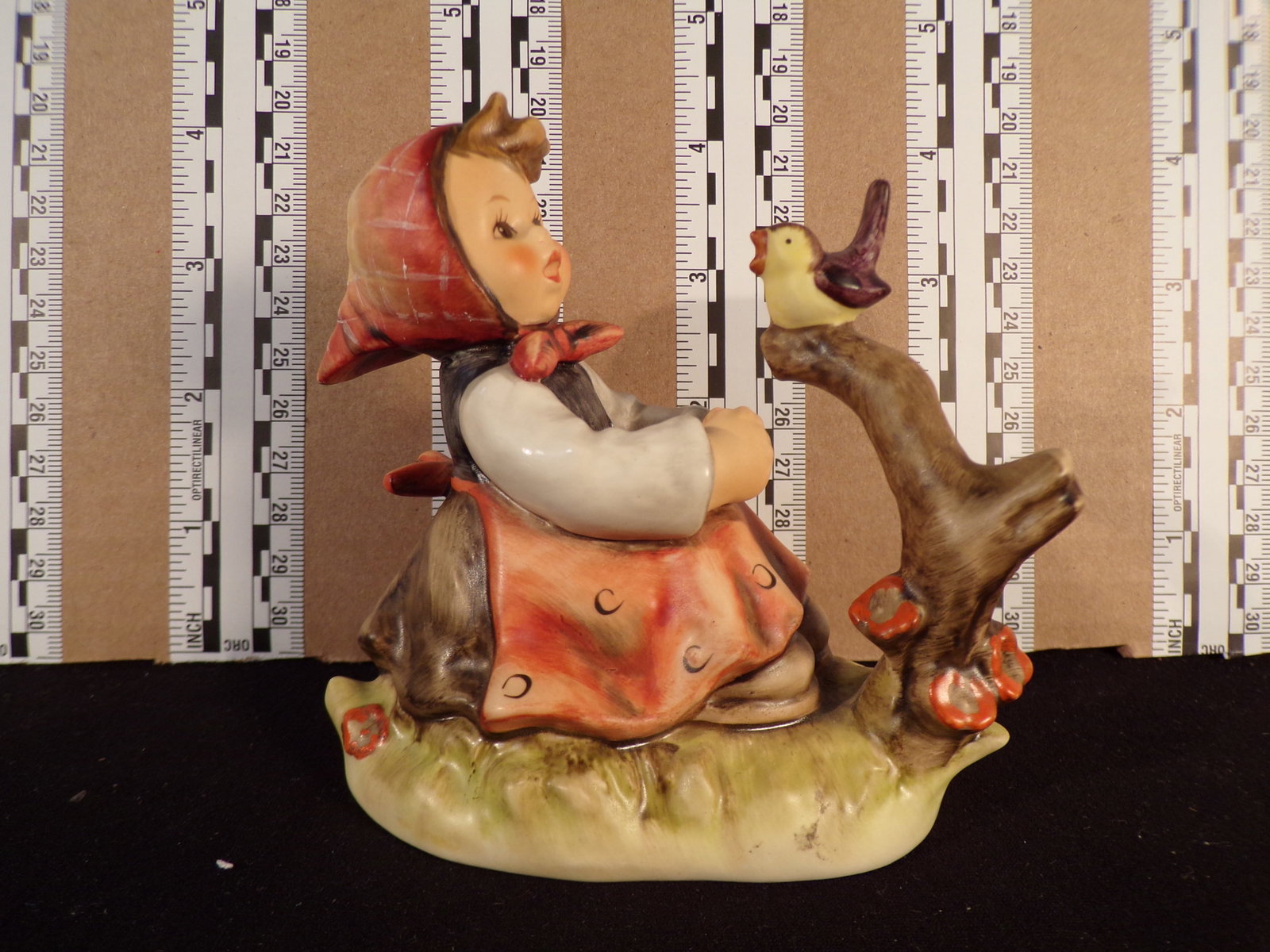 Hummel #414, Trademark # - 6, Figurine Name - In Tune: Up for auction is Hummel #414, Trademark # - 6, Figurine Name - In Tune, This hummel does not have a box and displays these special attributes: None. This Hummel is in excellent condition with no chip