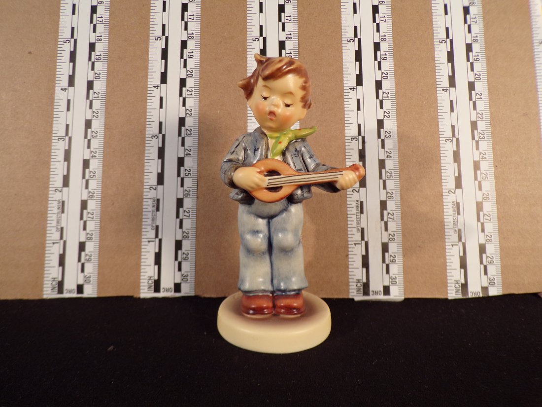 Hummel #558, Trademark # - 7, Figurine Name - Little Troubador: Up for auction is Hummel #558, Trademark # - 7, Figurine Name - Little Troubador, This hummel does have a box and displays these special attributes: None. This Hummel is in excellent condition with no