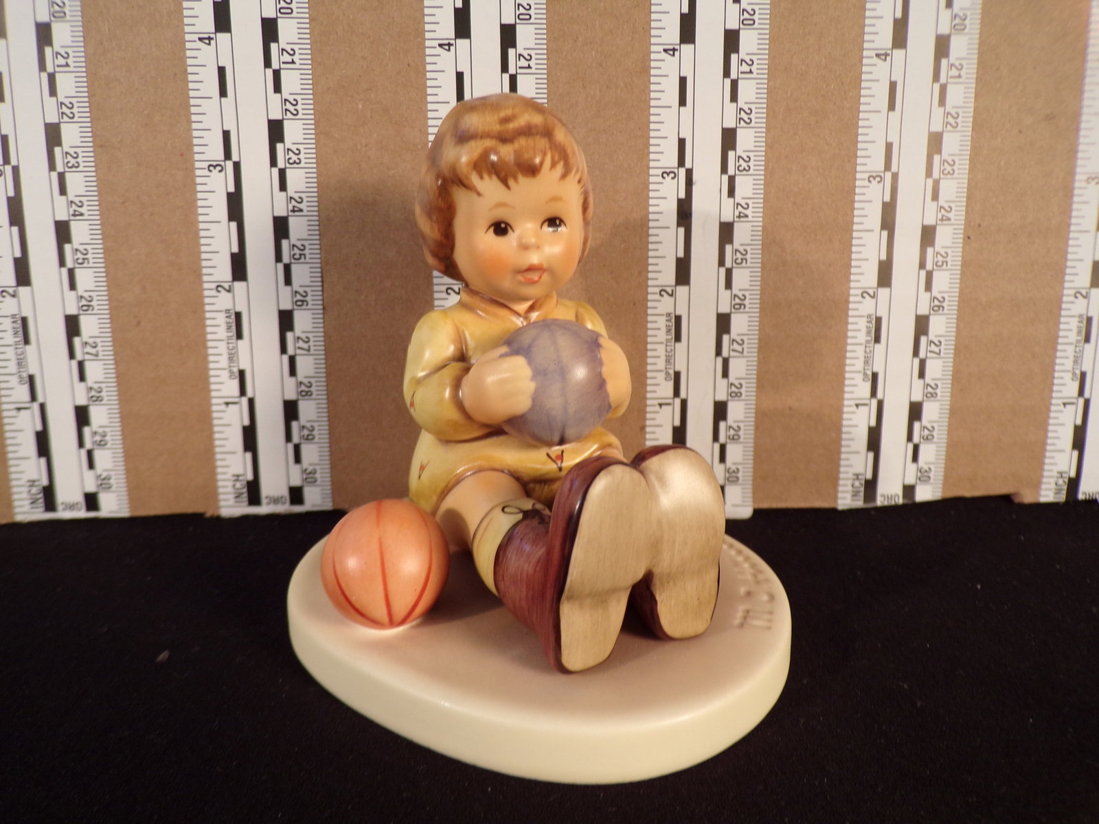 Hummel #632, Trademark # - 7, Figurine Name - At Play: Up for auction is Hummel #632, Trademark # - 7, Figurine Name - At Play, This hummel does have a box and displays these special attributes: None. This Hummel is in excellent condition with no chips or
