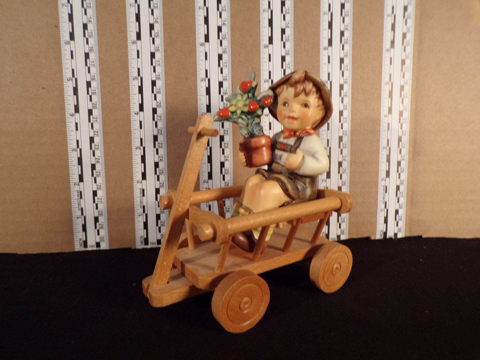 Hummel #699, Trademark # - 7, Figurine Name - Love In Bloom: Up for auction is Hummel #699, Trademark # - 7, Figurine Name - Love In Bloom, This hummel does not have a box and displays these special attributes: First Issue 1999 Blue Stamp. This Hummel is in exc