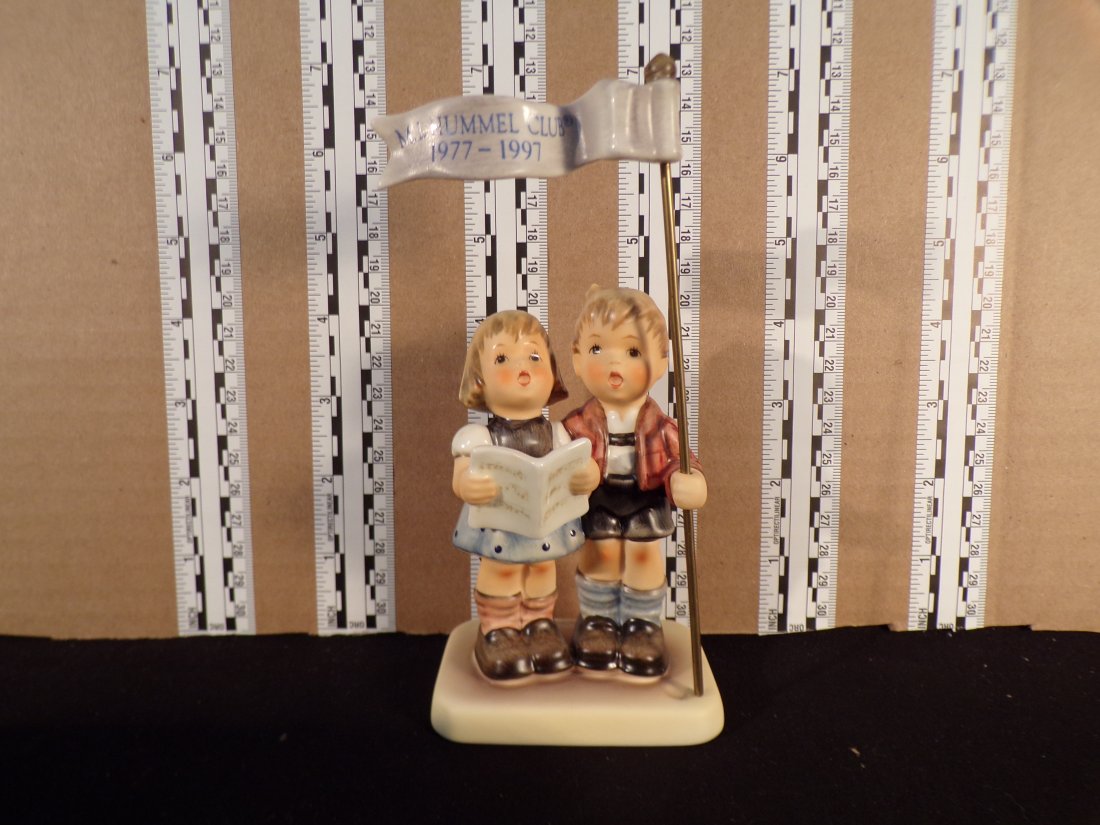 Hummel #790, Trademark # - 7, Figurine Name - Celebrate With Song: Up for auction is Hummel #790, Trademark # - 7, Figurine Name - Celebrate With Song, This hummel does have a box and displays these special attributes: None. This Hummel is in excellent condition with