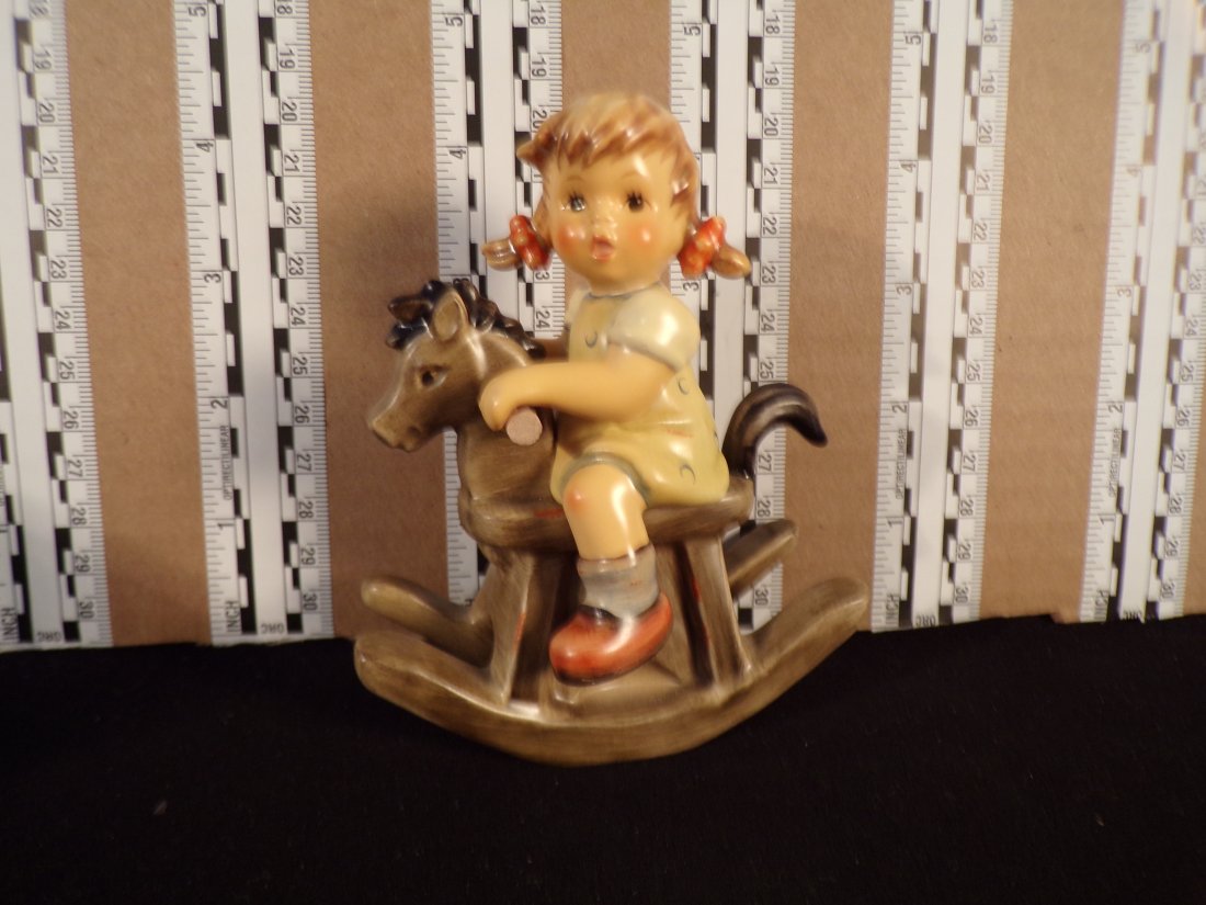 Hummel #2021, Trademark # - 8, Figurine Name - Cowboy Corral: Up for auction is Hummel #2021, Trademark # - 8, Figurine Name - Cowboy Corral, This hummel does have a box and displays these special attributes: None. This Hummel is in excellent condition with no c