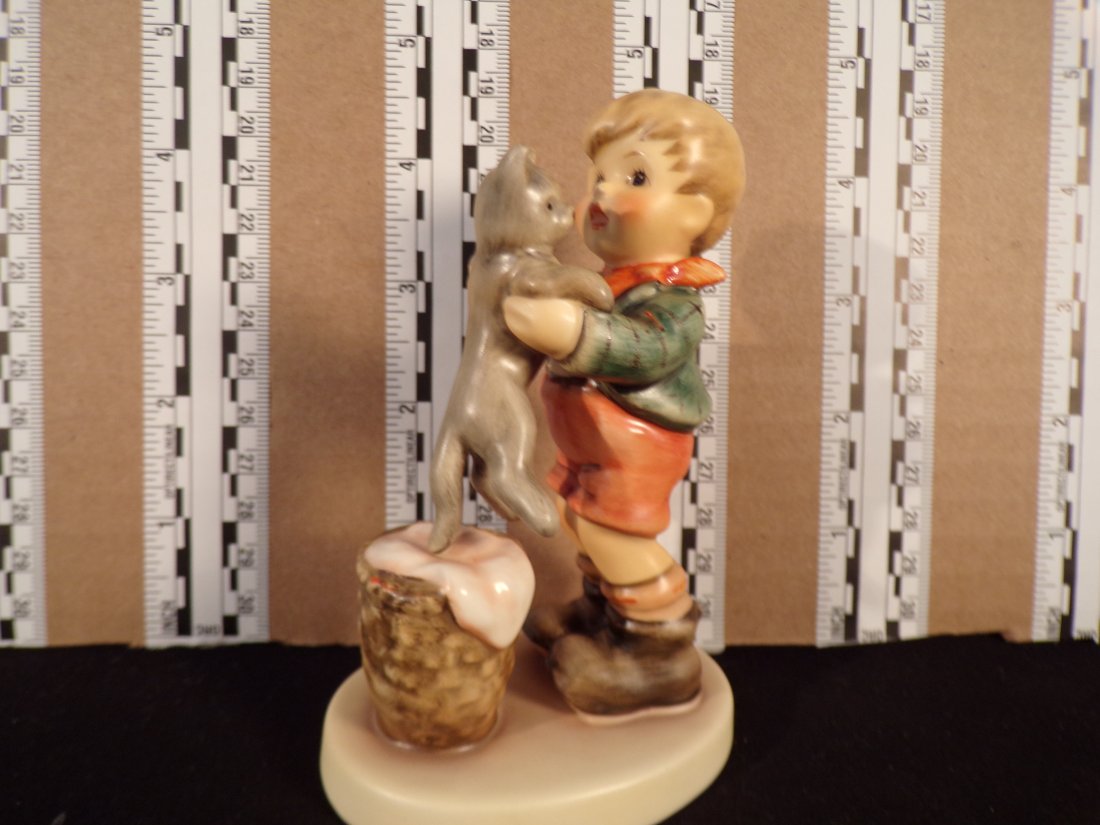 Hummel #2033, Trademark # - 9, Figurine Name - Kitty Kisses: Up for auction is Hummel #2033, Trademark # - 9, Figurine Name - Kitty Kisses, This hummel does have a box and displays these special attributes: None. This Hummel is in excellent condition with no ch