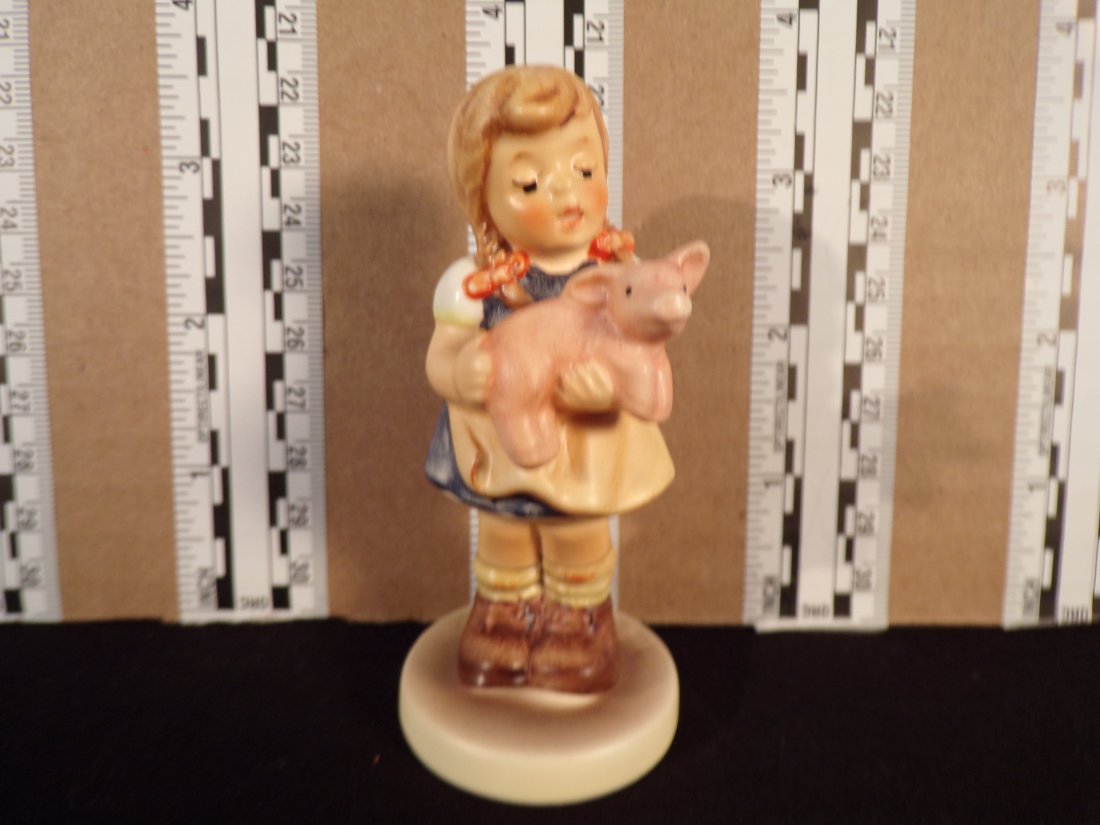 Hummel #2052, Trademark # - 7, Figurine Name - Pigtails: Up for auction is Hummel #2052, Trademark # - 7, Figurine Name - Pigtails, This hummel does not have a box and displays these special attributes: M.I. Hummel Club 1999/2000. This Hummel is in excellen