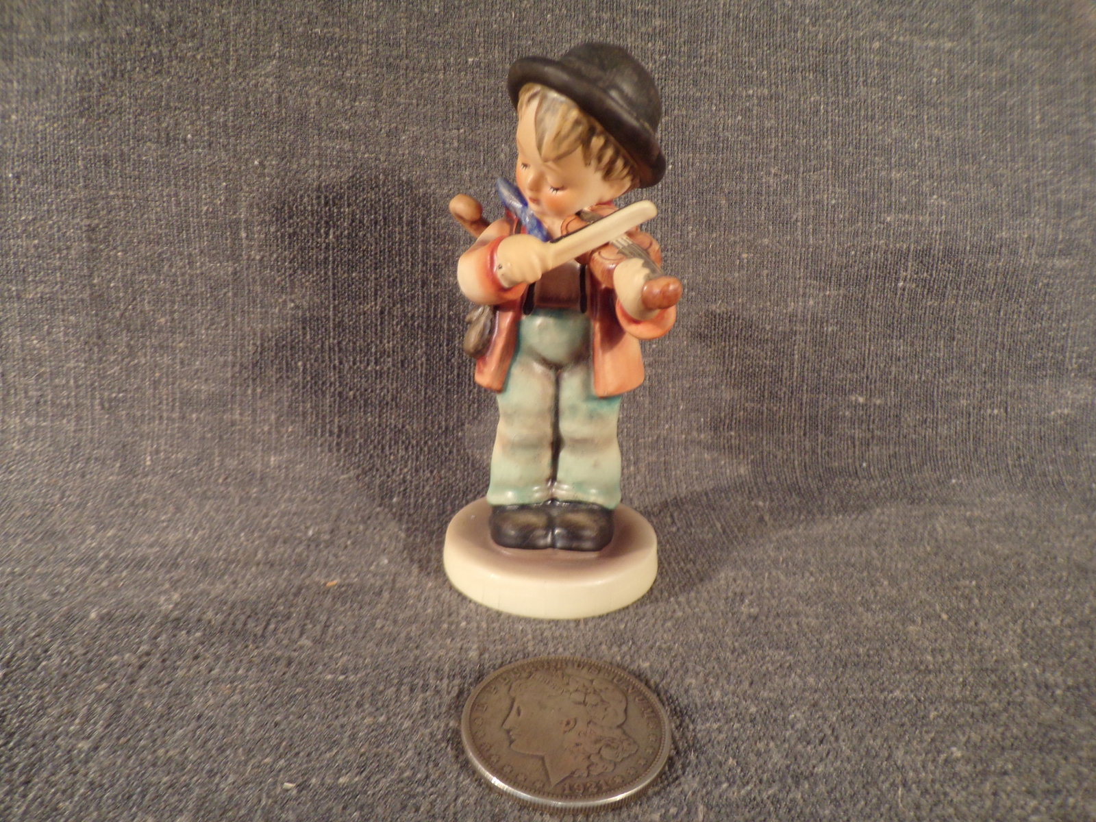 Hummel #4, Size Indicator - none, Trademark # - 3, Figurine Name - Little Fiddler.: Up for auction is Hummel #4, Size Indicator - none, Trademark # - 3, Figurine Name - Little Fiddler. This hummel does not have a box and displays these special attributes: None. This Hummel is in exce