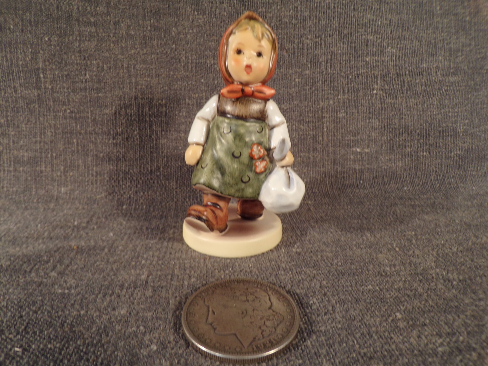 Hummel #561, Size Indicator - none, Trademark # - 7, Figurine Name - Grandma's Girl (First Issue): Up for auction is Hummel #561, Size Indicator - none, Trademark # - 7, Figurine Name - Grandma's Girl (First Issue). This hummel does not have a box and displays these special attributes: First Issue 