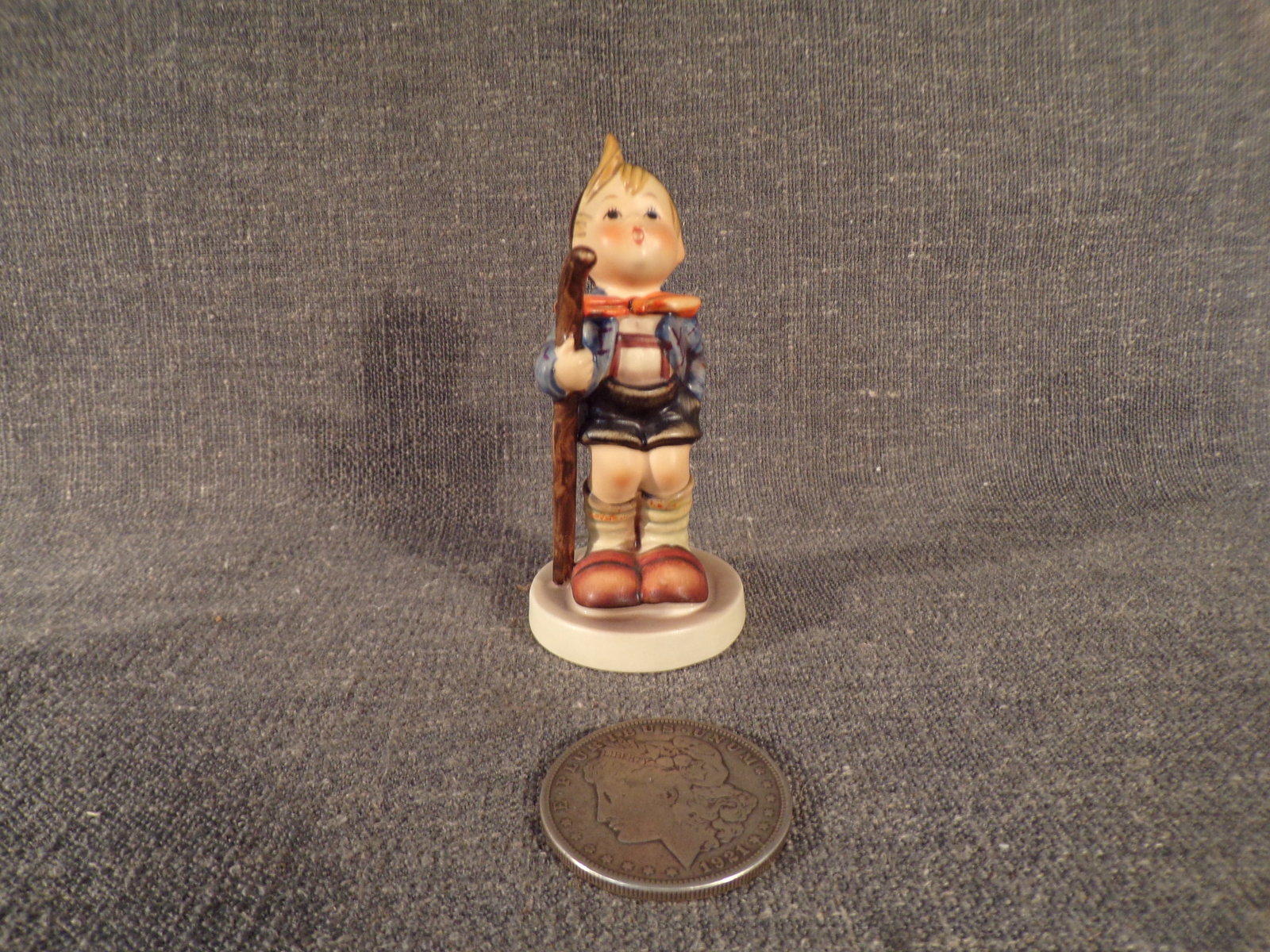 Hummel #16, Size Indicator - 16/2/0, Trademark # - 3, Figurine Name - Little Hiker: Up for auction is Hummel #16, Size Indicator - 16/2/0, Trademark # - 3, Figurine Name - Little Hiker. This hummel does not have a box and displays these special attributes: None. This Hummel is in exc