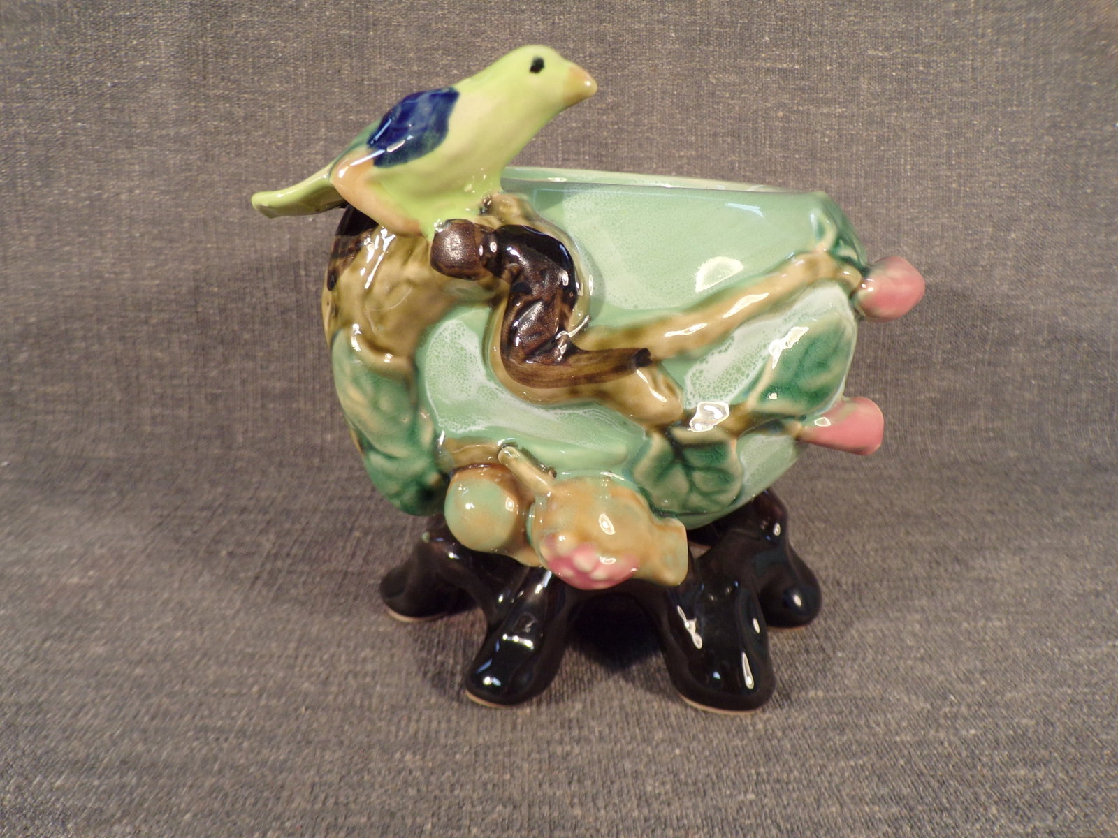 Vintage Majolica Bird on Nest Planter Figurine.: Vintage Majolica Bird on Nest Planter Figurine. This Figurine is in Excellent Condition with no chips or cracks. It measures 6" tall and 5" in diameter. It rests on 8 tree branch feet as shown. No mar