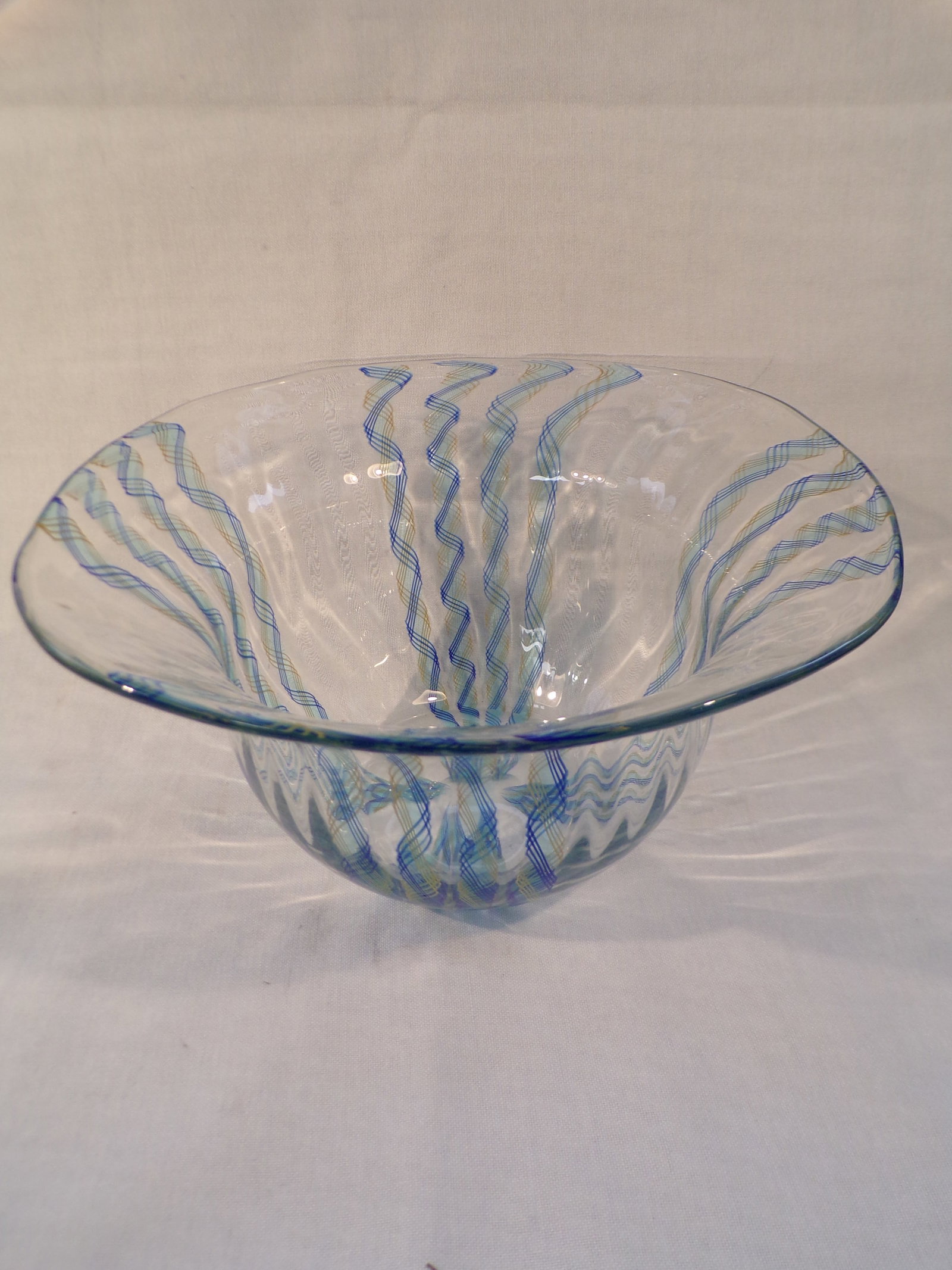 Vintage Mid Century Modern Murano Glass Latticino Helmet Form Bowl.: Vintage Mid Century Modern Murano Glass Latticino Helmet Form Bowl. This Murano Bowl is in Excellent Condition with no chips or cracks. It has blue and yellow ribbon striped latticino as pictured. It 