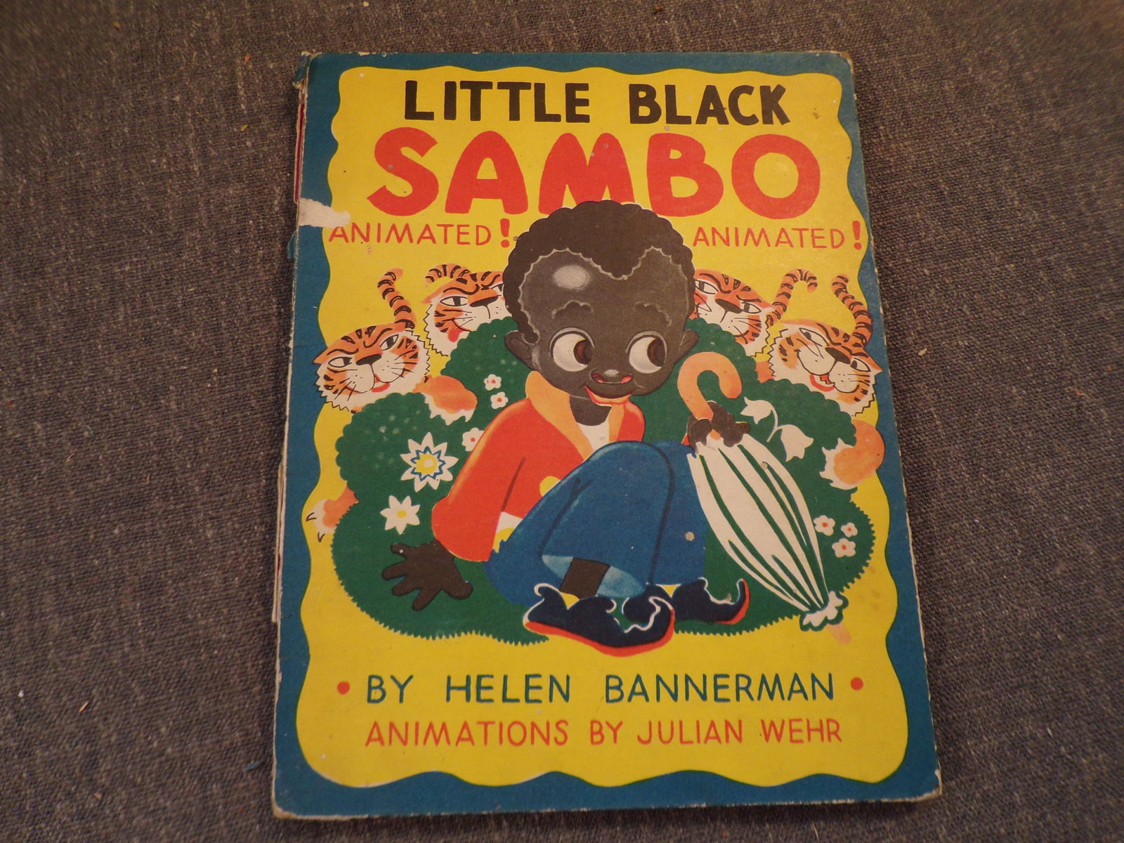Circa 1940's Little Black Sambo by Helen BANNERMAN - Animations by Julian Wehr.: Circa 1940's Little Black Sambo by Helen BANNERMAN - Animations by Julian Wehr. This book is in Fair or better condition as pictured. Publisher's pictorial comb bound paper-covered boards. Color illus