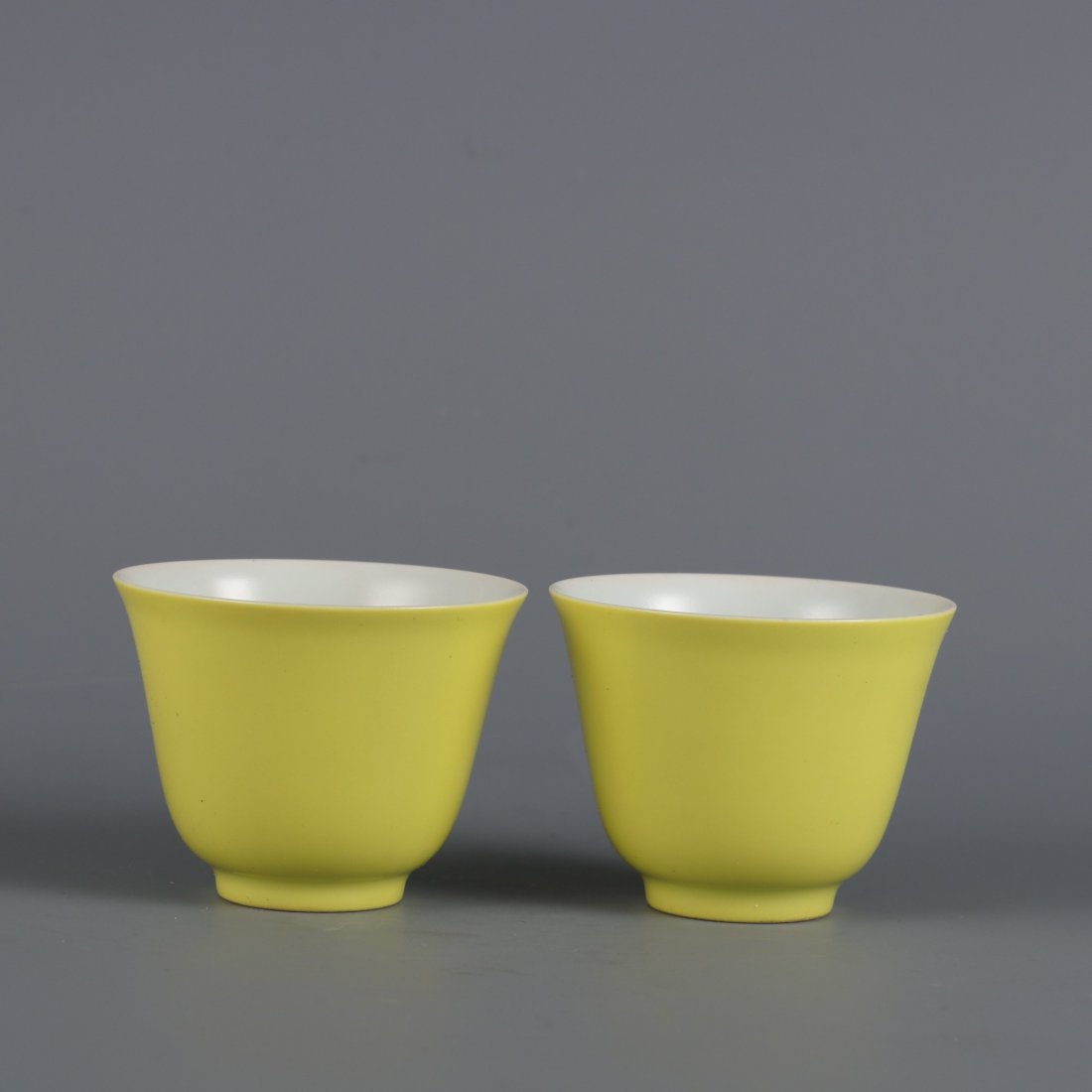 A pair of lemon yellow glaze painted pastel cups made in the Yongzheng period of the Qing Dynasty (1 of 9)