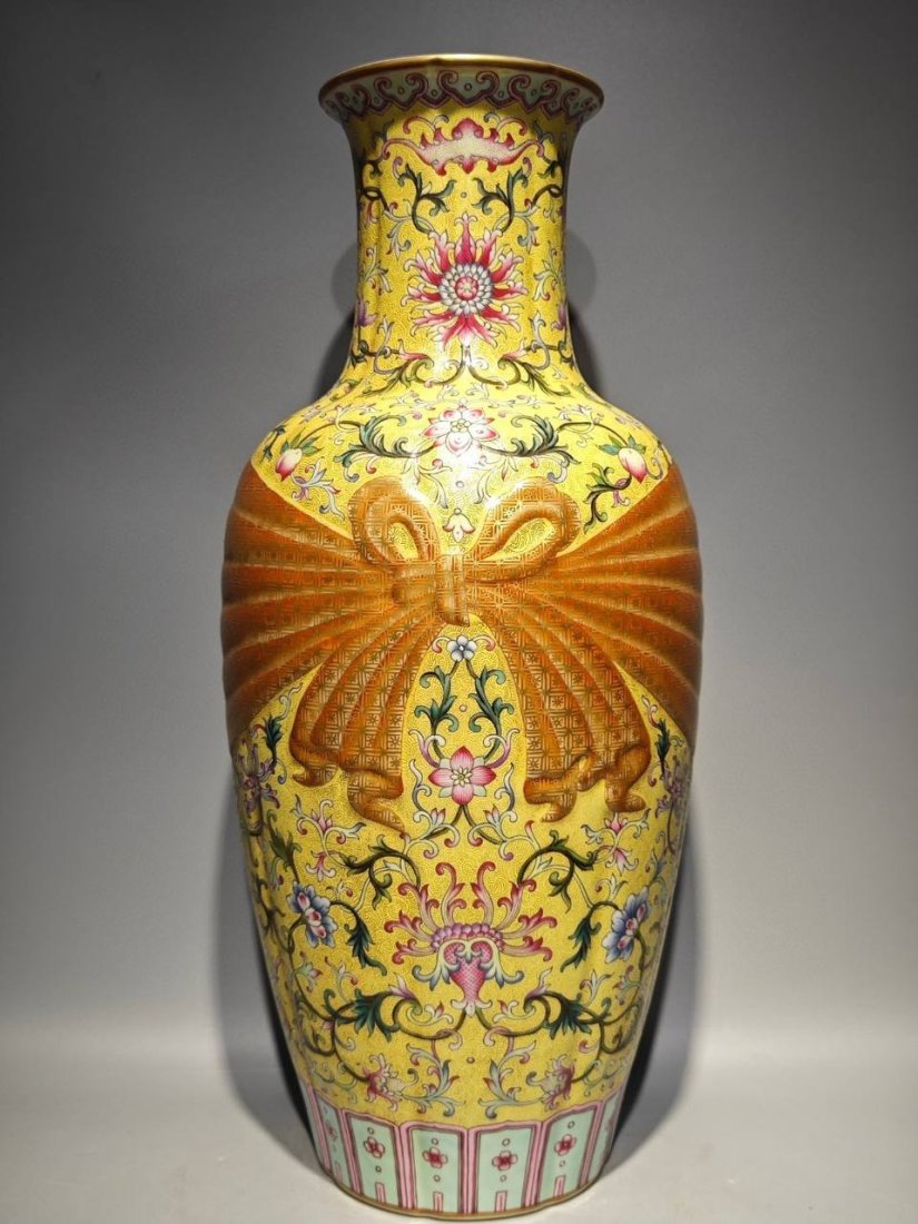 Qianlong period of the Qing Dynasty, a yellow ground enamel vase with floral patterns: Qianlong period of the Qing Dynasty, a yellow ground enamel vase with floral patterns and a ribbon depicting Guanyin, height: 45.6cm, belly diameter: 21cm