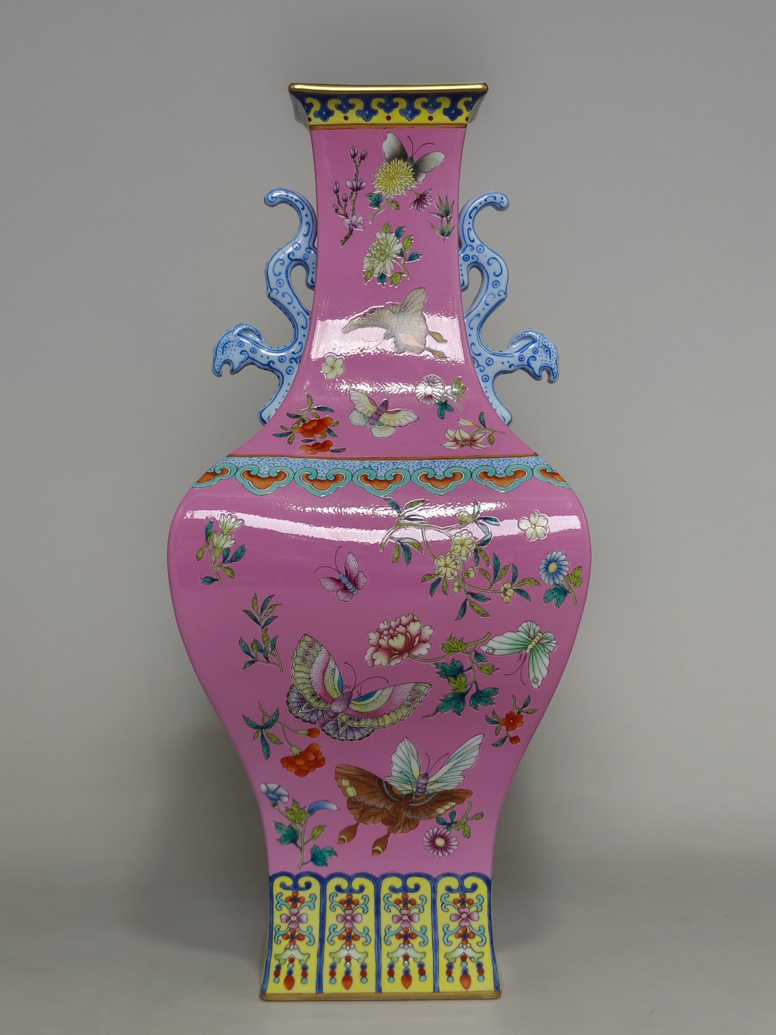 A Qing Dynasty Qianlong-era famille rose palace-pink-bottomed dish with floral designs and two: , 40 cm high and 17.5 cm in diameter.