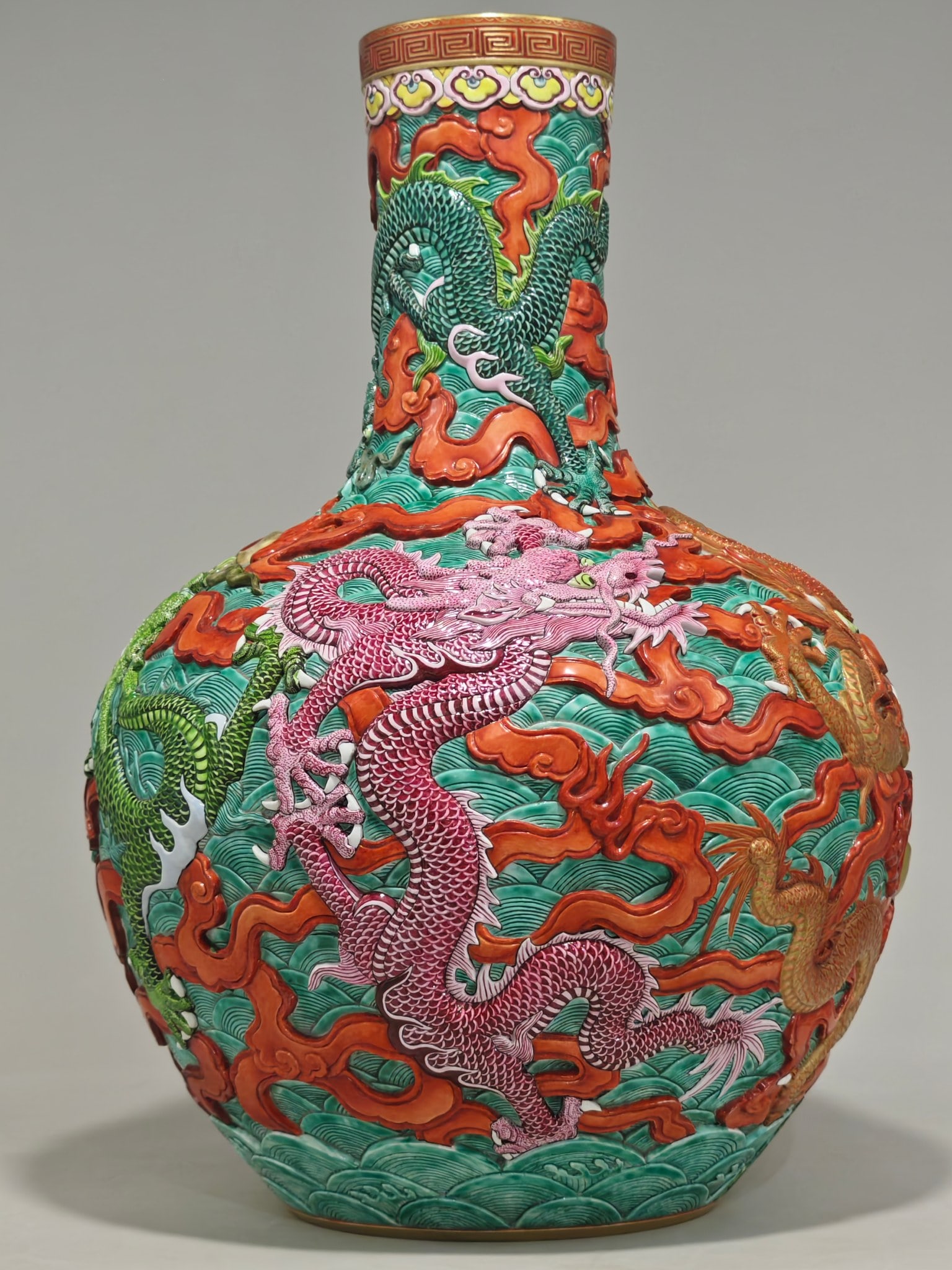 A Qing Dynasty Qianlong period-marked enamel-carved celestial globe vase with a five-dragon pattern: , 54.5 cm high and 38 cm in diameter.